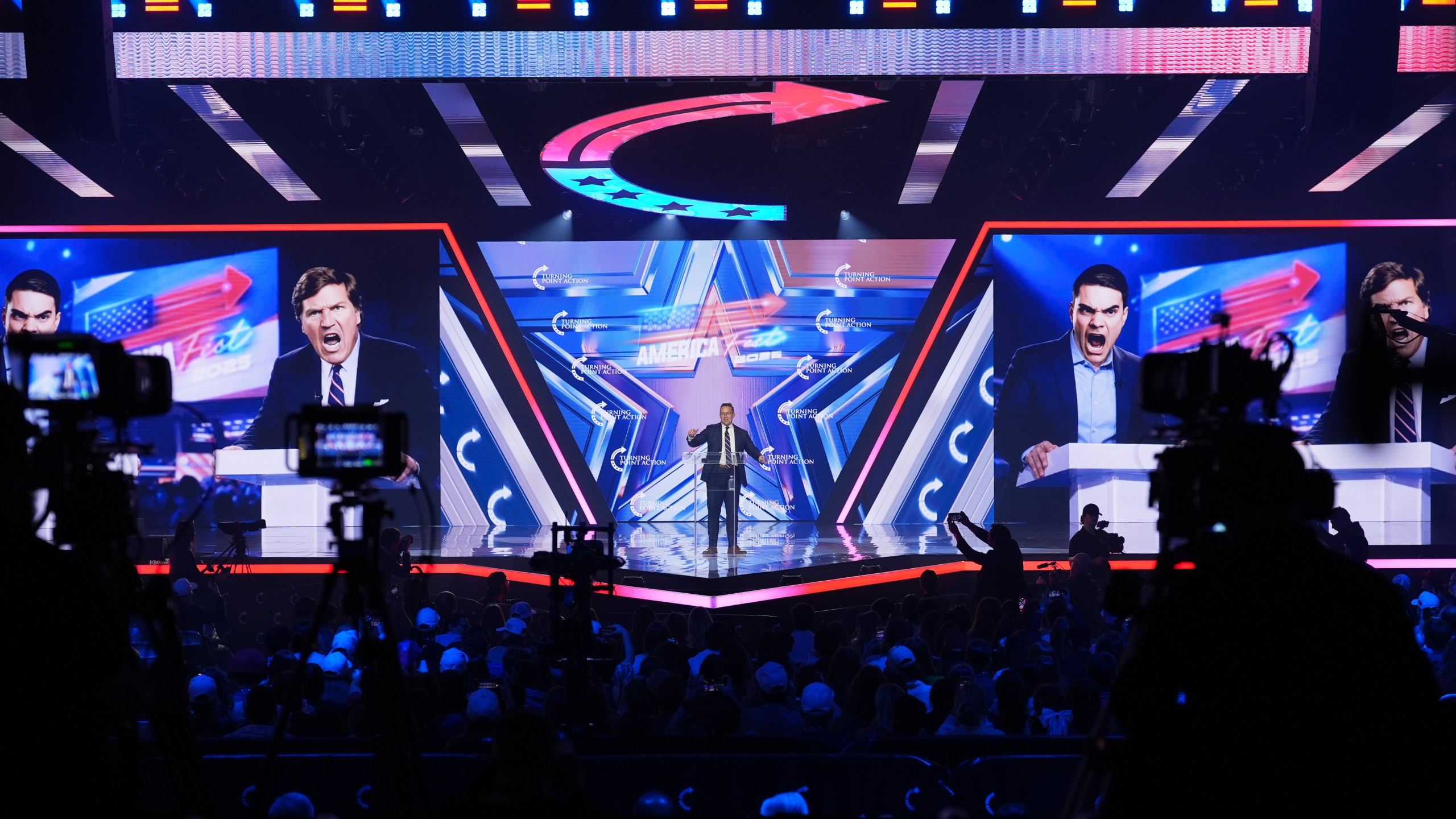 Benny Johnson speaks during Turning Point USA's AmericaFest 2025, Saturday, Dec. 20, 2025, in Phoenix. (AP Photo/Ross D. Franklin)