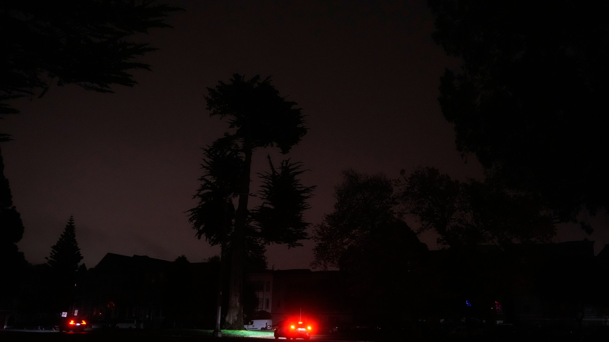 The taillights from a vehicle are shown as power outages darken the streets, in San Francisco, Saturday, Dec. 20, 2025. (AP Photo/Jeff Chiu)