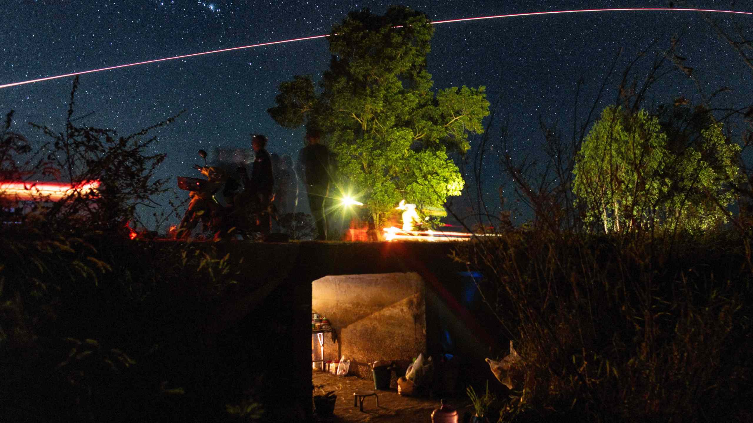 Village security volunteer patrol while Thai military fires artillery towards Cambodia, Saturday, Dec. 20, 2025, in Surin province, Thailand. (AP Photo/Wason Wanichakorn)