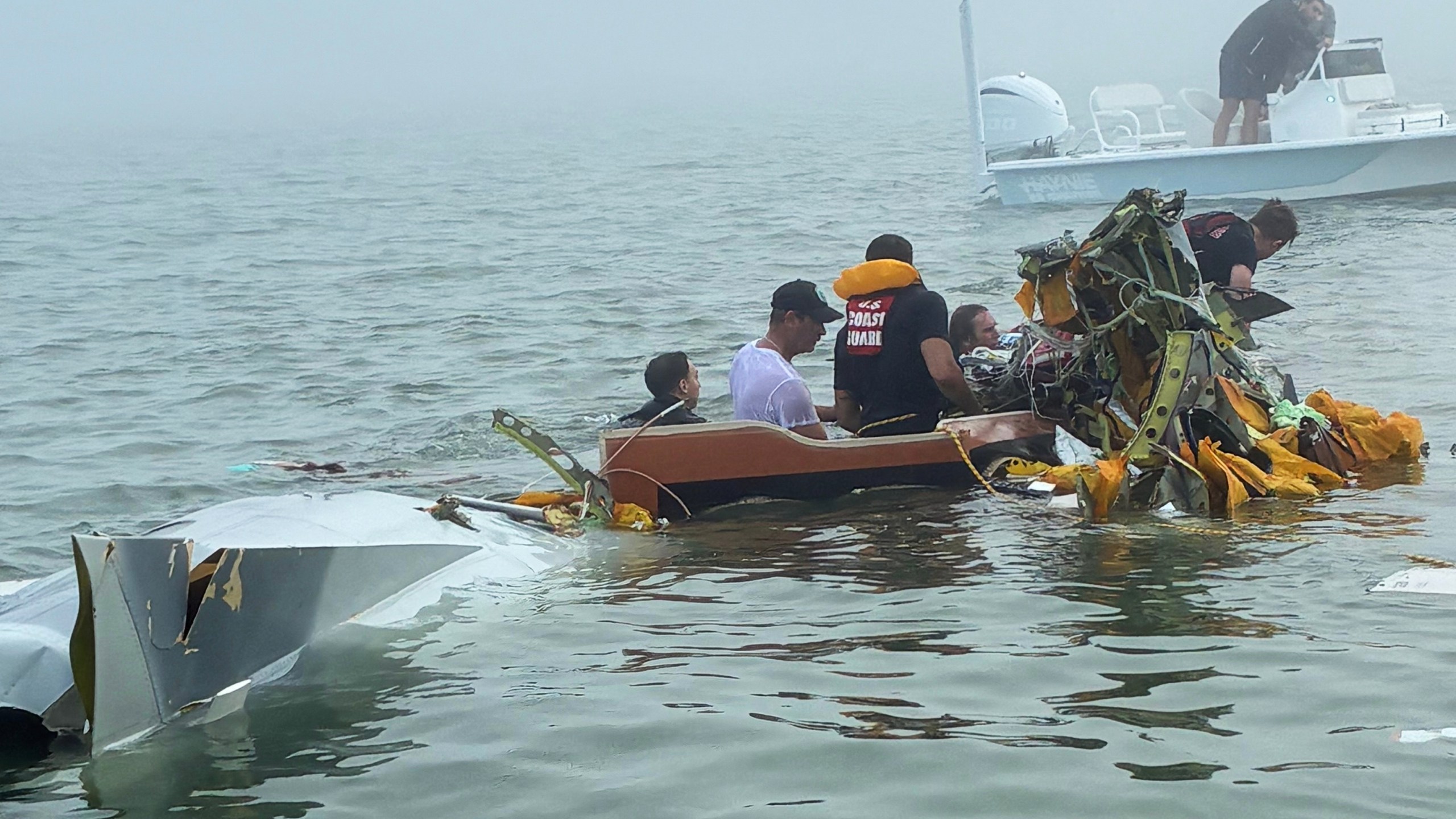 In this image provided by Sky Decker Jr., authorities and volunteers respond to a Mexican Navy plane crash near Galveston, Texas, Monday, Dec. 22, 2025. (Sky Decker Jr. via AP)null