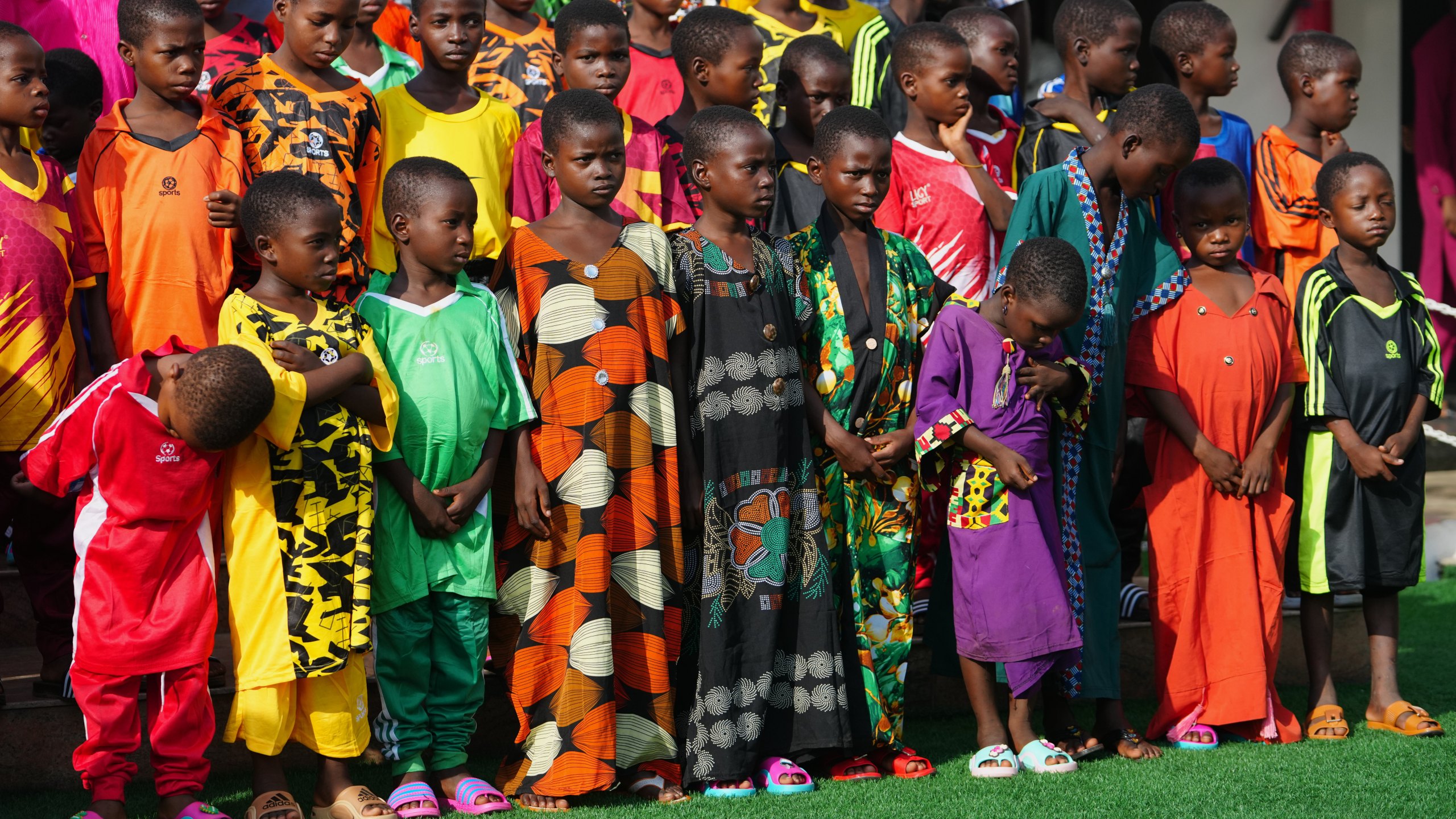 Freed students of St. Mary's Catholic School in the Papiri community pose for photographs upon their arrival at the government house, in Minna, Nigeria, Monday, Dec. 22, 2025. (AP Photo/Sunday Alamba)