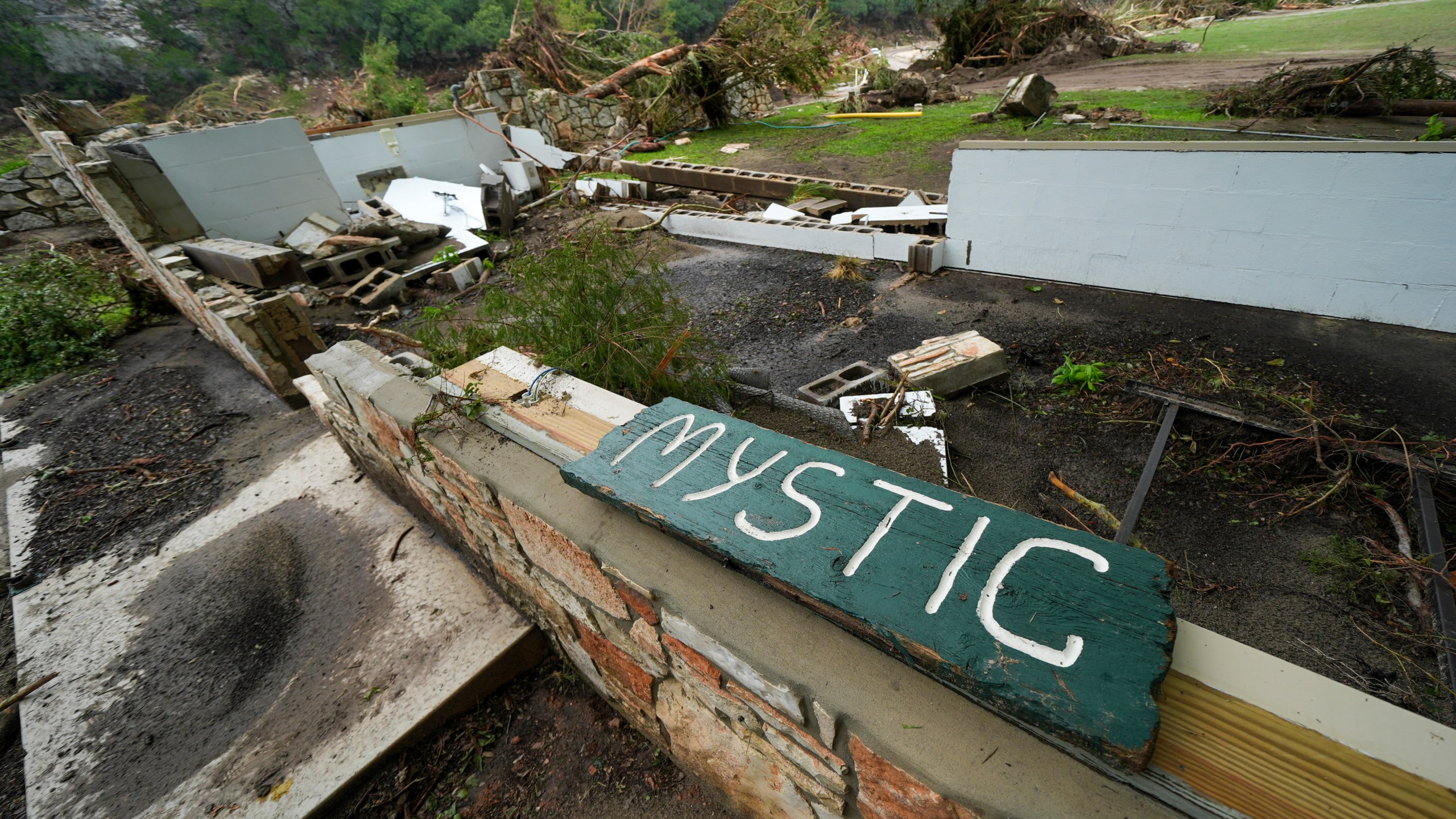 FILE - A Camp Mystic sign is seen near the entrance to the establishment along the banks of the Guadalupe River in Hunt, Texas, July 5, 2025, after a flash flood swept through the area. (AP Photo/Julio Cortez, File)