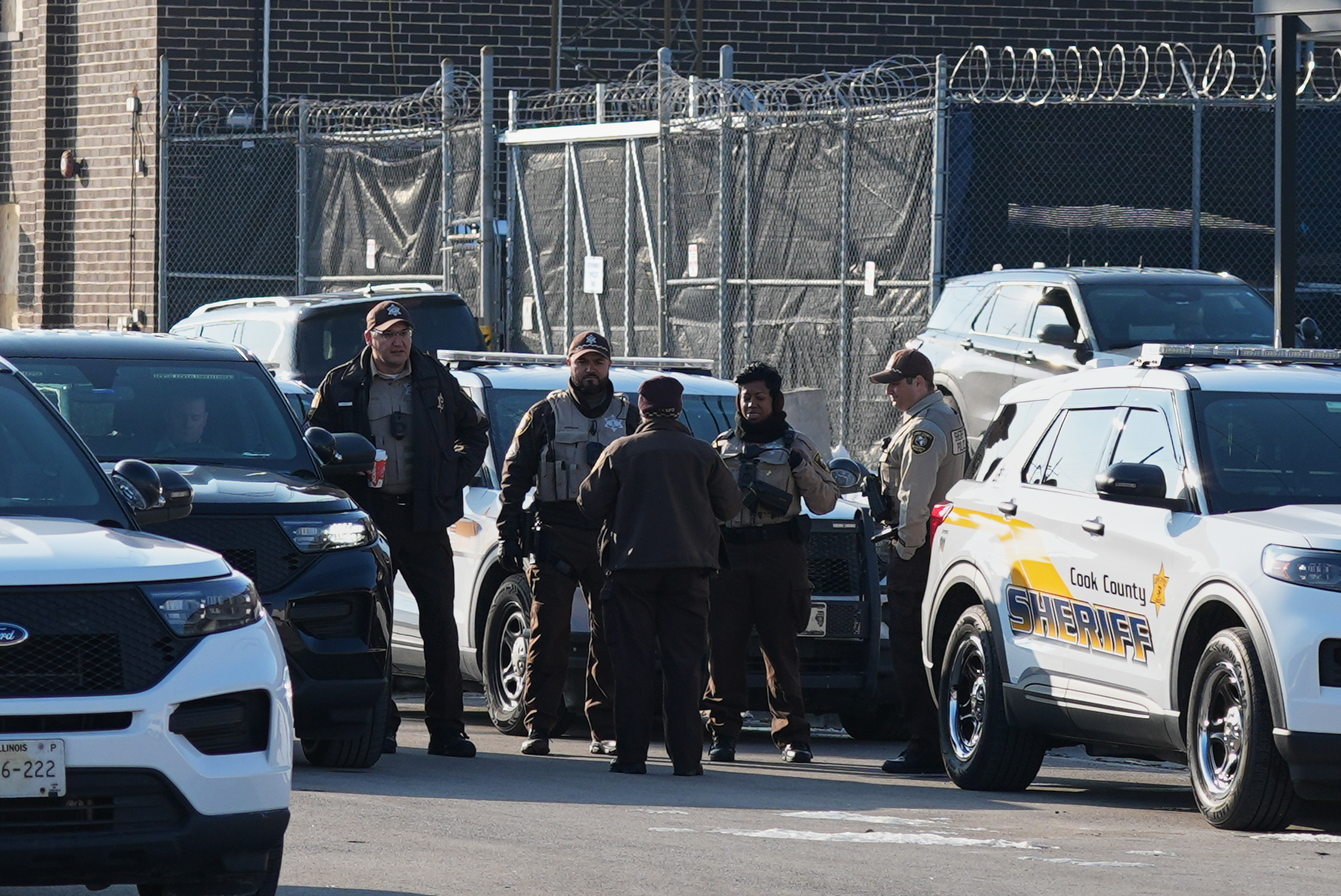 Law enforcement officers guard as protesters gather outside an ICE processing facility in the Chicago suburb of Broadview, Ill., Friday, Dec. 12, 2025. (AP Photo/Nam Y. Huh)