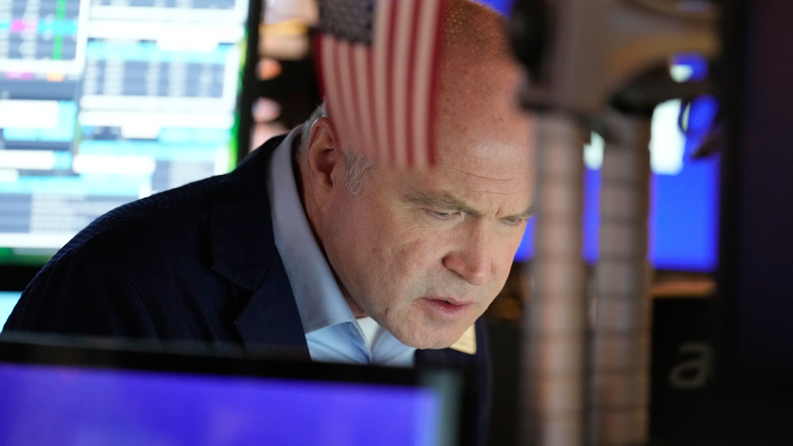 Derek Orth works on the floor at the New York Stock Exchange in New York, Wednesday, Dec. 10, 2025. (AP Photo/Seth Wenig)