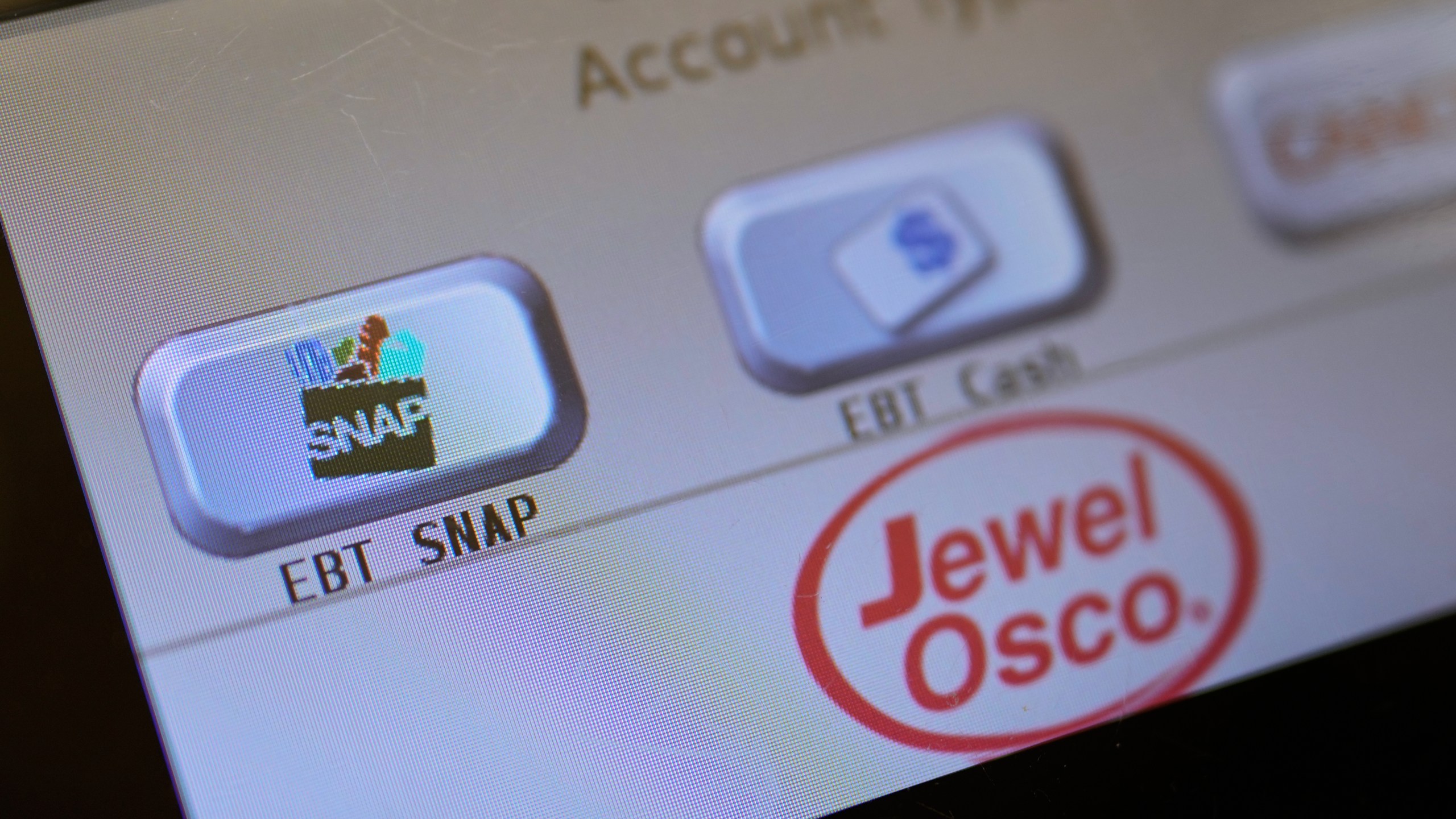 FILE - An EBT SNAP sign is shown on a self check out screen at a grocery store in Mount Prospect, Ill., Saturday, Nov. 1, 2025. (AP Photo/Nam Y. Huh, File)