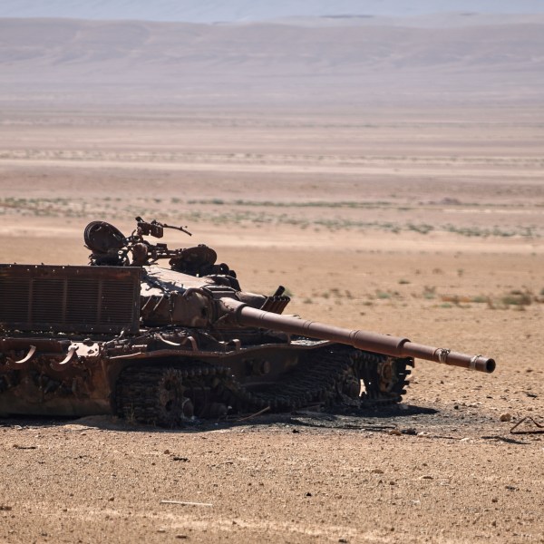 A tank sits in the desert
