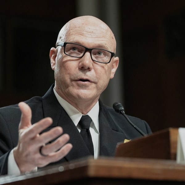Frank M. Bradley gestures during a hearing