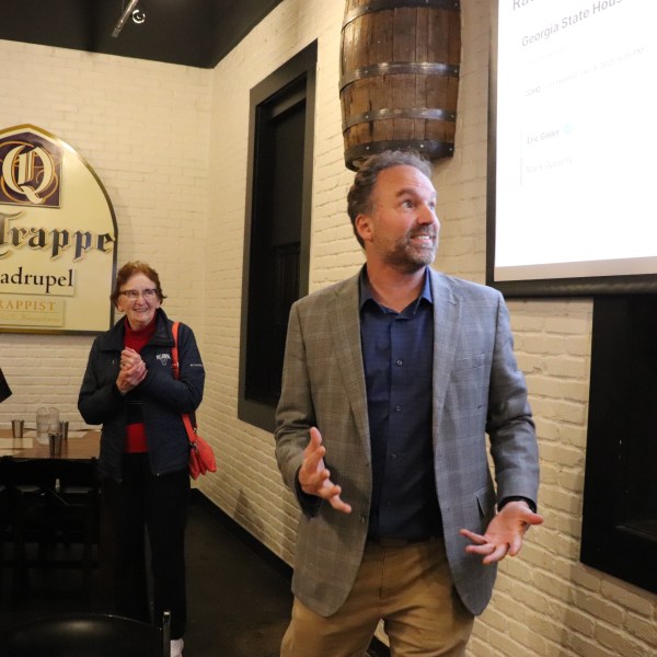 Eric Gisler watching election returns with supporters