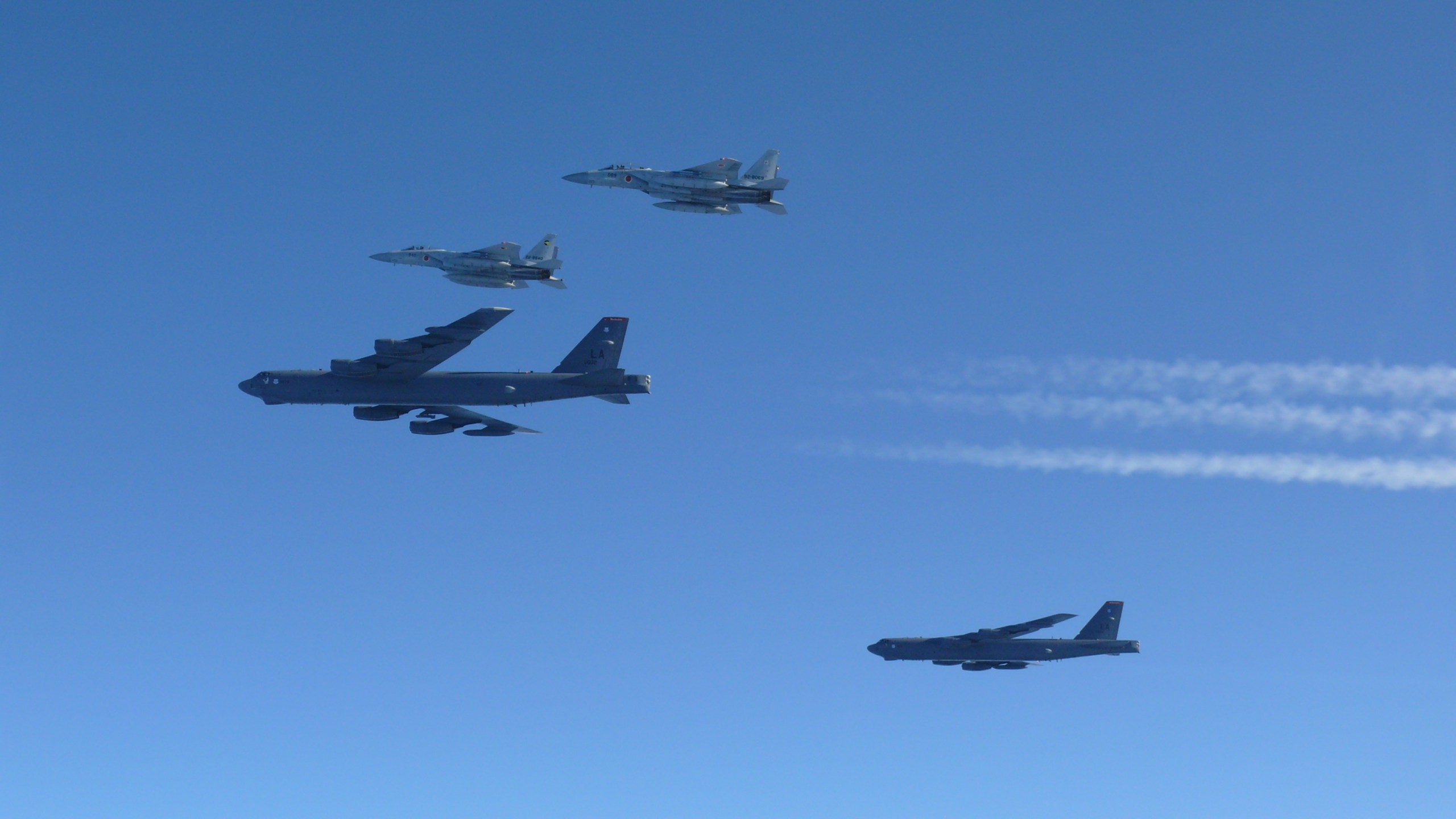 Japan's F-15 fighters holding a joint military drill with the U.S. B-52 bombers
