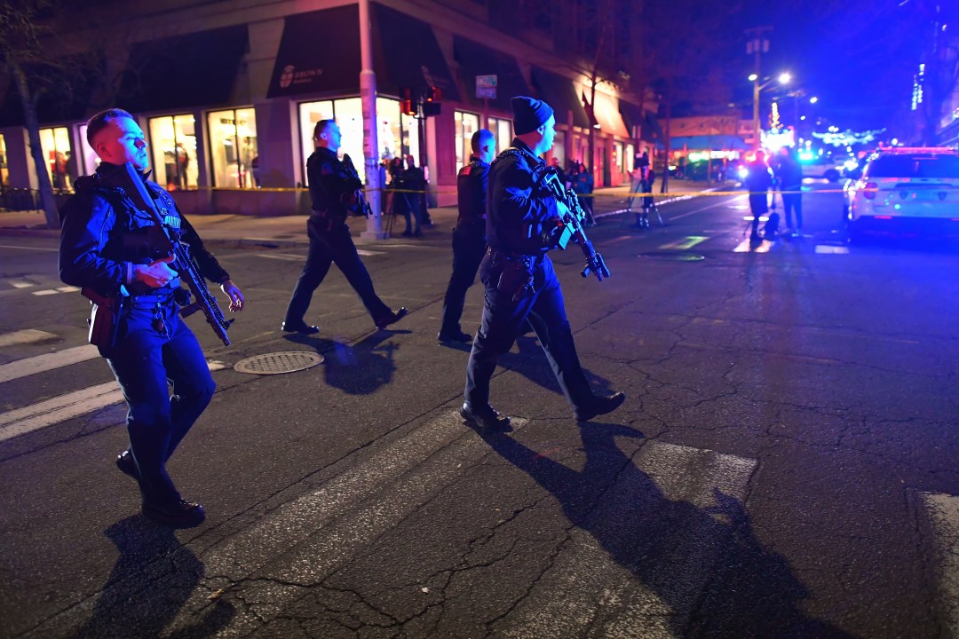 Police with rifles at night