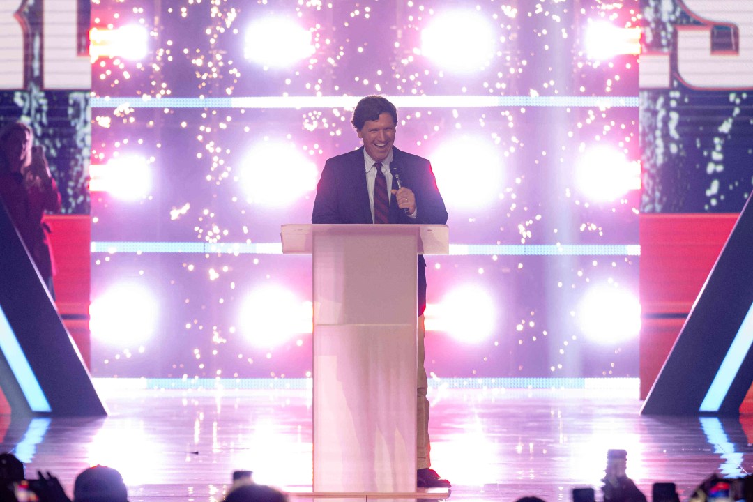 Tucker Carlson speaks onstage
