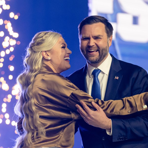 Erika Kirk embraces Vice President JD Vance onstage