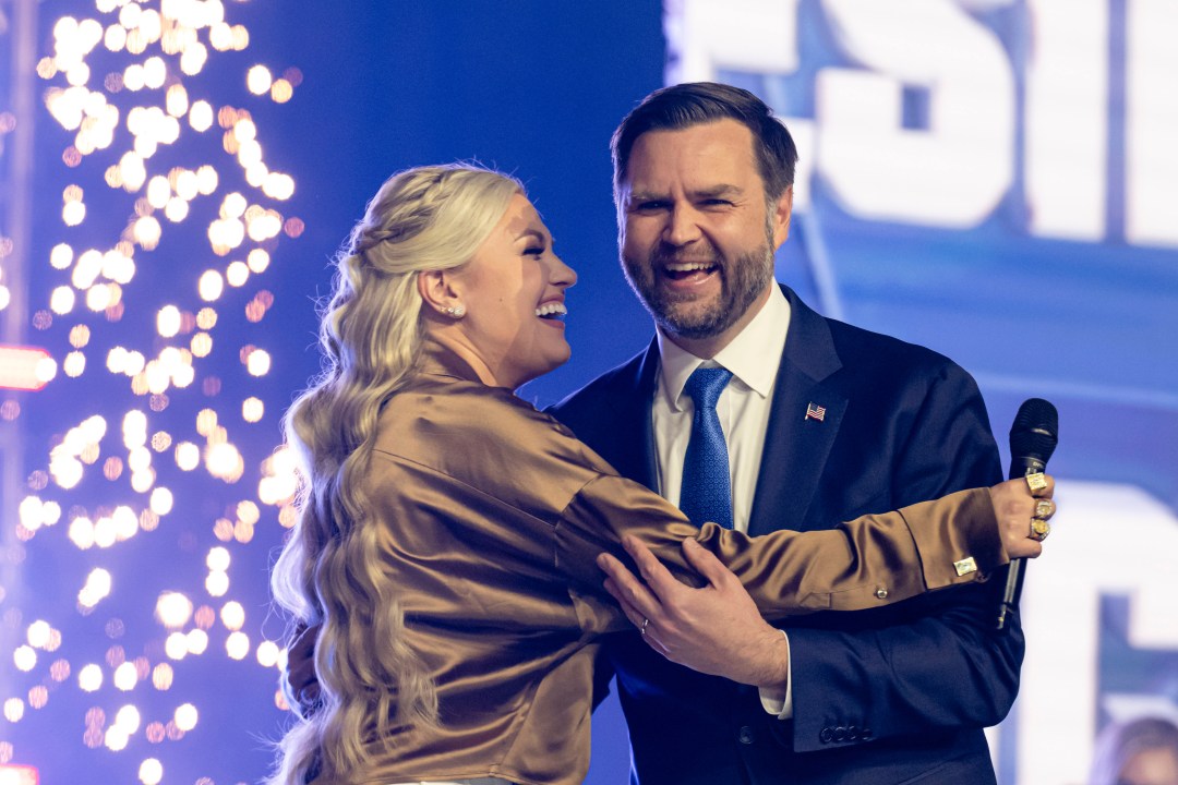 Erika Kirk embraces Vice President JD Vance onstage