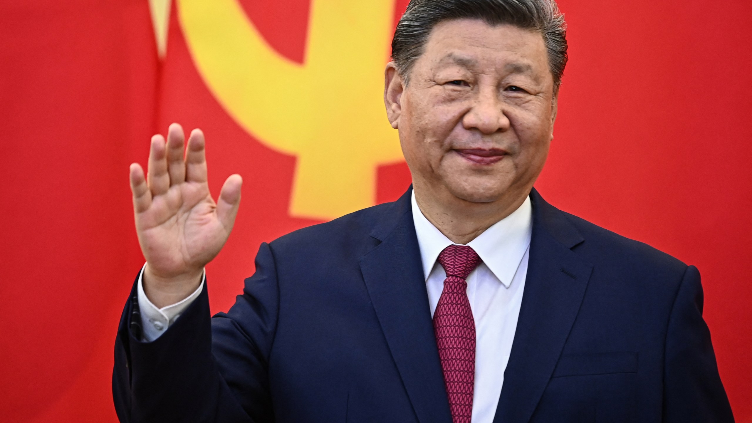 Chinese President Xi Jinping waves