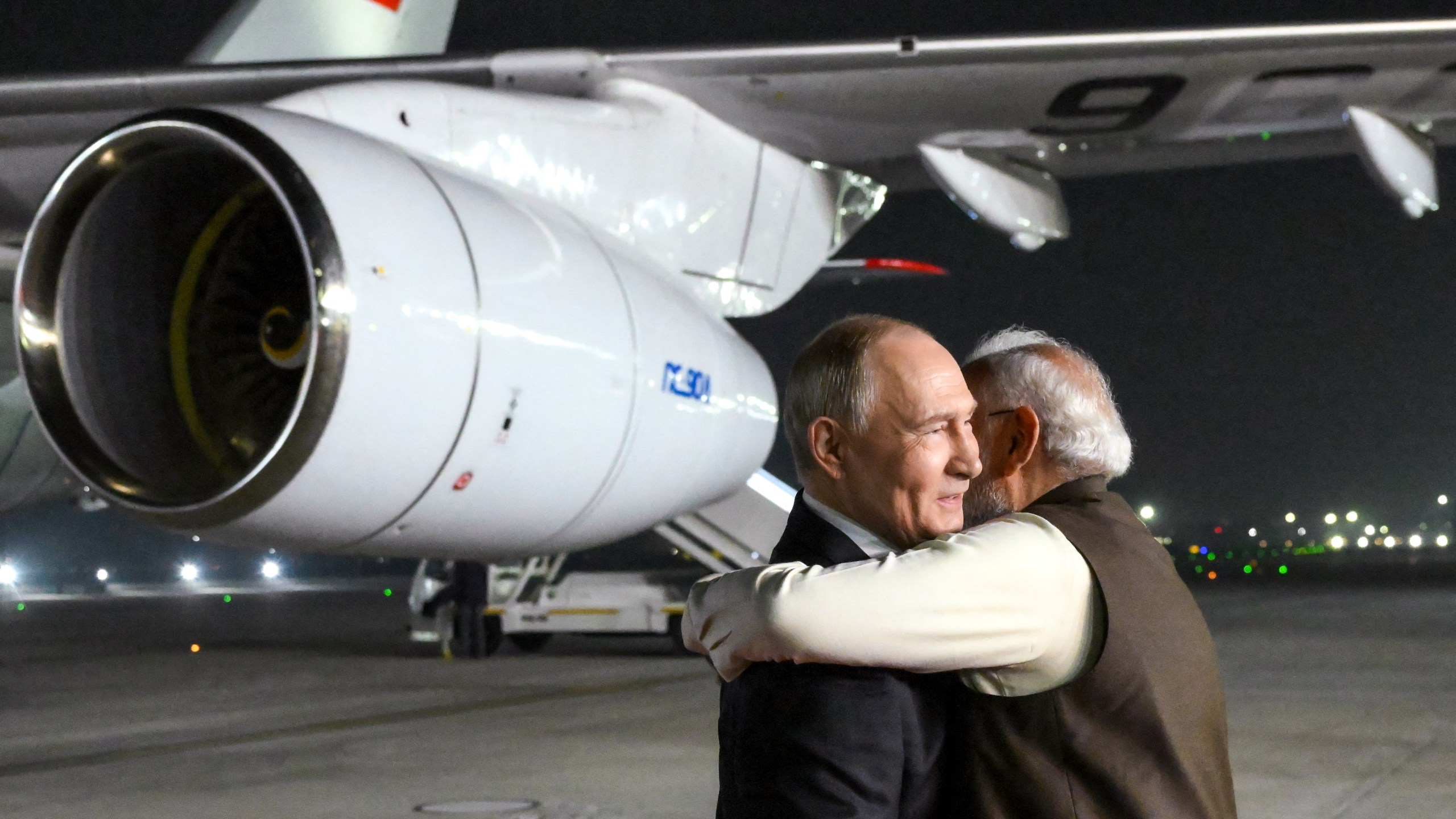 Russia's President Vladimir Putin is welcomed by Indian Prime Minister Narendra Modi upon the Russian leader's arrival at Palam Air Force Base in New Delhi.