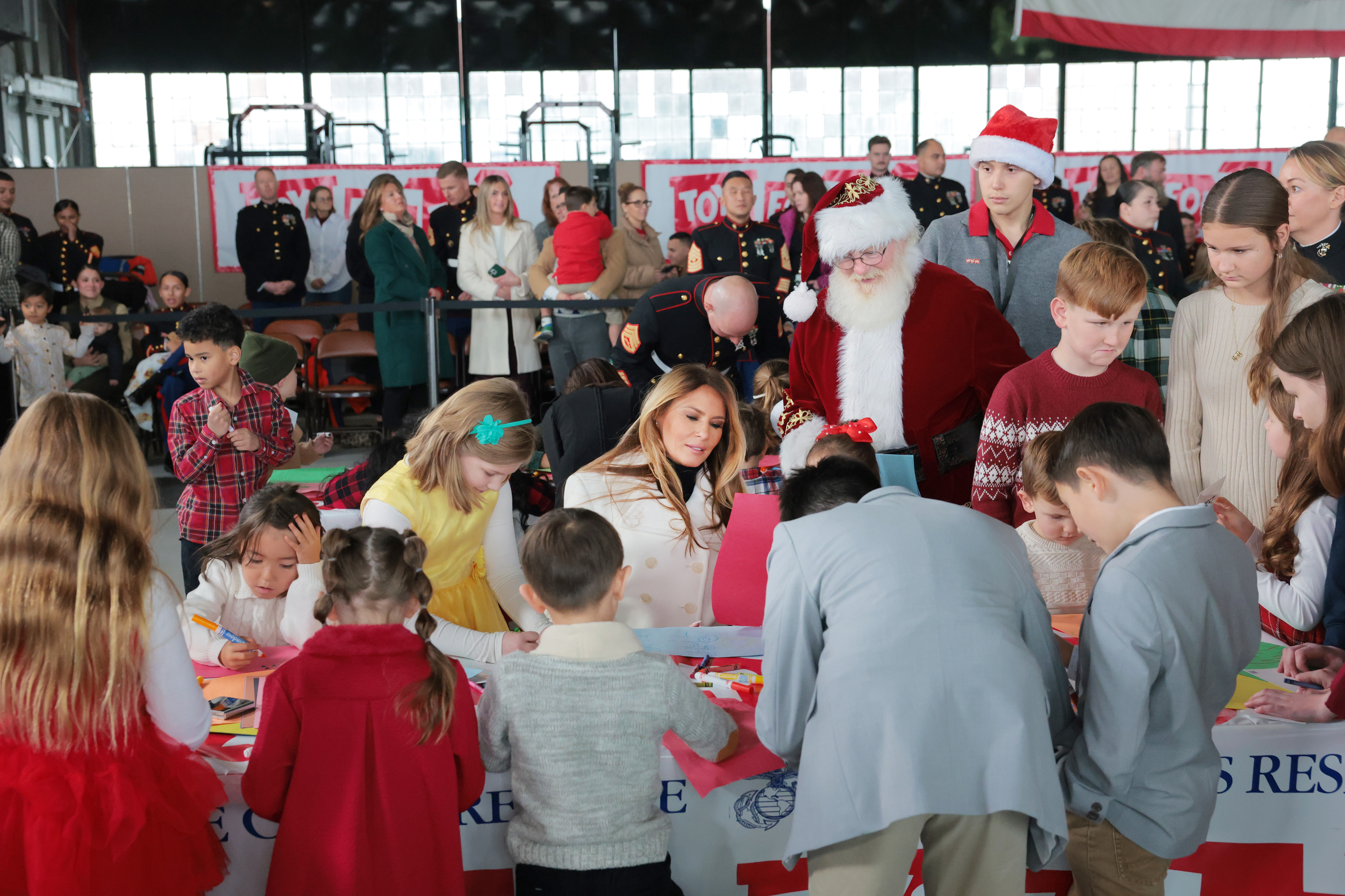 First lady Melania Trump visits with children of service members during a Toys for Tots Charity Drive 