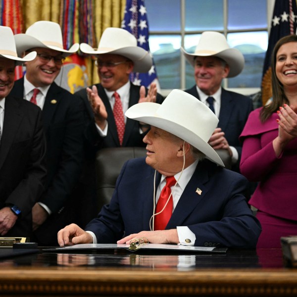 Trump in white cowboy hat