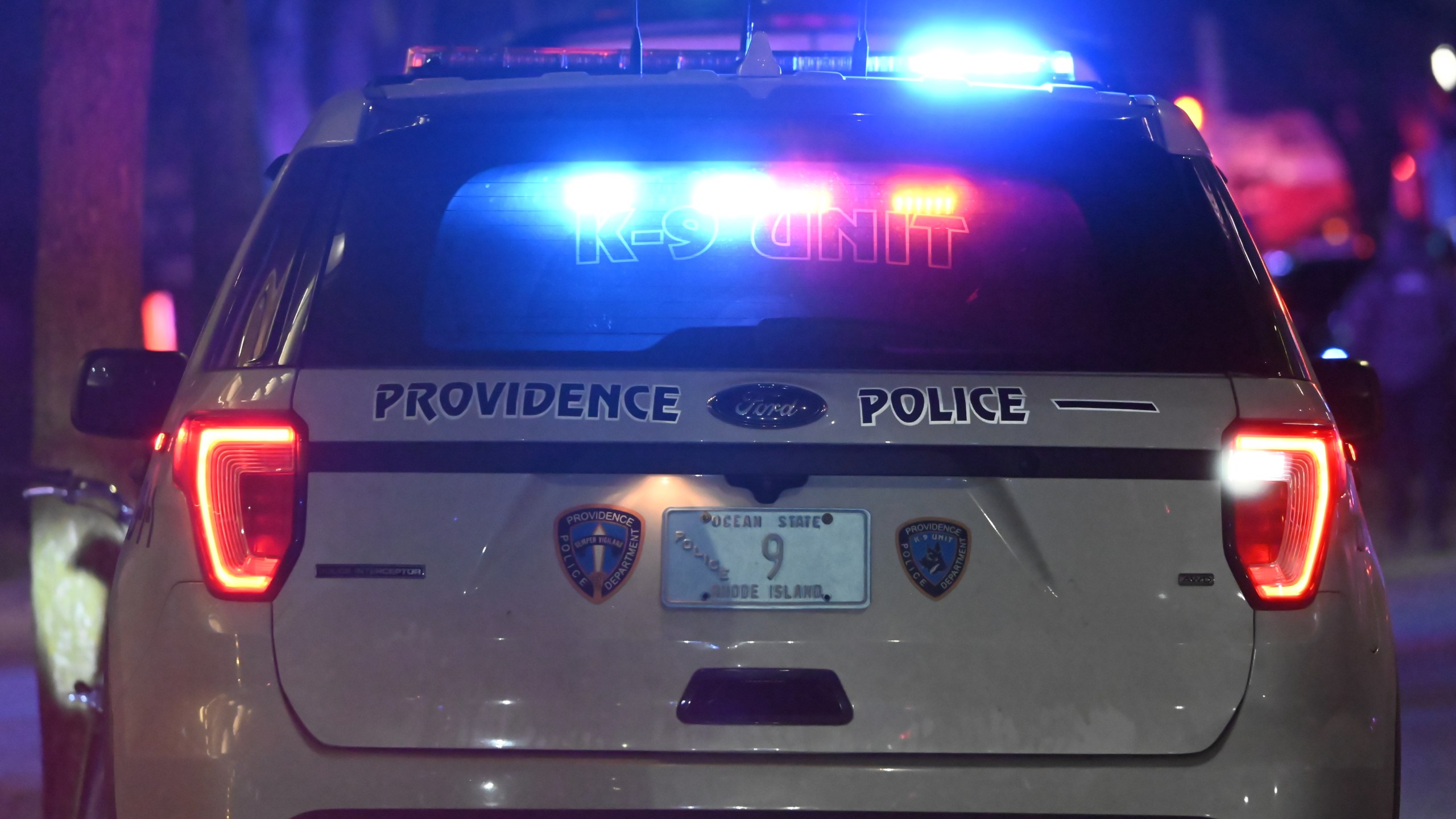 Back of Providence police vehicle with emergency lights