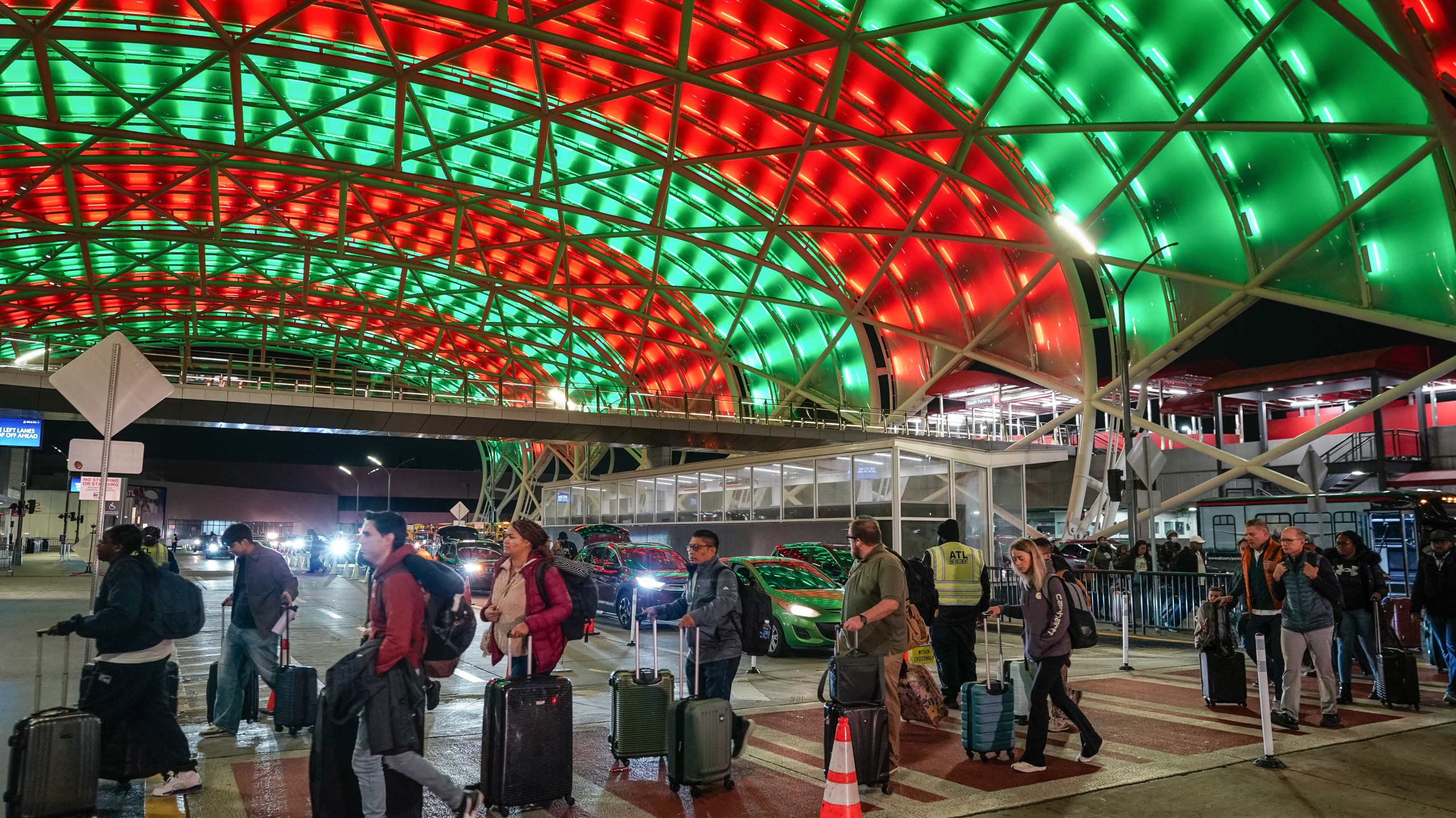 Travelers arrive at a terminal of Hartsfield-Jackson Atlanta International Airport