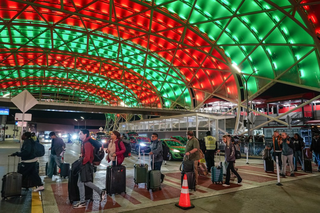 Travelers arrive at a terminal of Hartsfield-Jackson Atlanta International Airport
