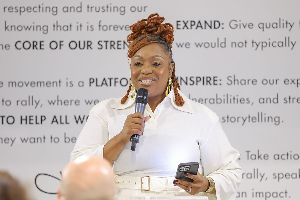 Kardea Brown with mic and phone