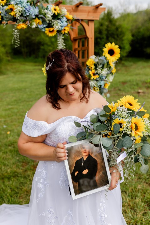 Bethany Hasel with a photo of her brother