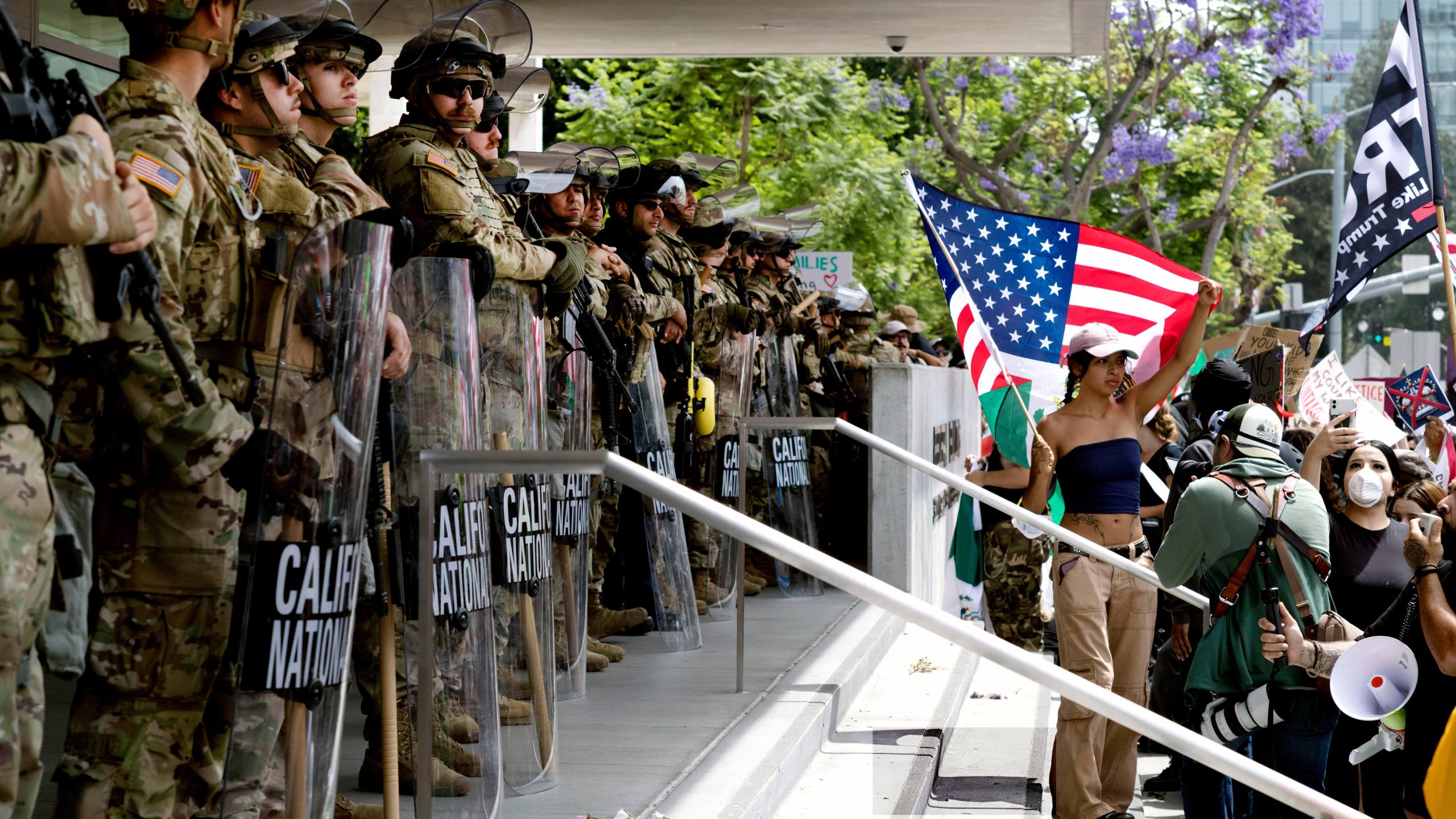 FILE - Protesters stand off against California National Guard soldiers at the Federal Building in downtown Los Angeles, during a "No Kings" protest, June 14, 2025. (AP Photo/Richard Vogel, File)