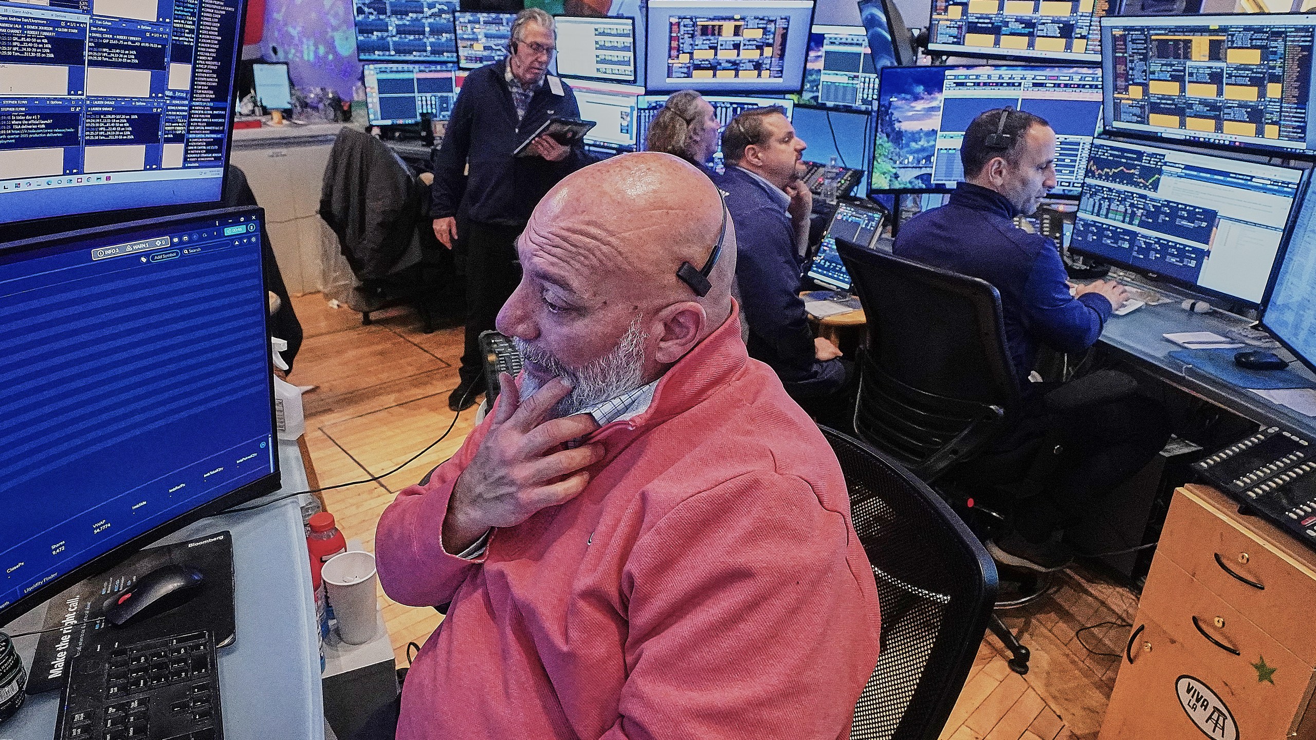 Trader Vincent Napolitano, foreground, works with colleagues on the floor of the New York Stock Exchange, Friday, Jan. 2, 2026. (AP Photo/Richard Drew)