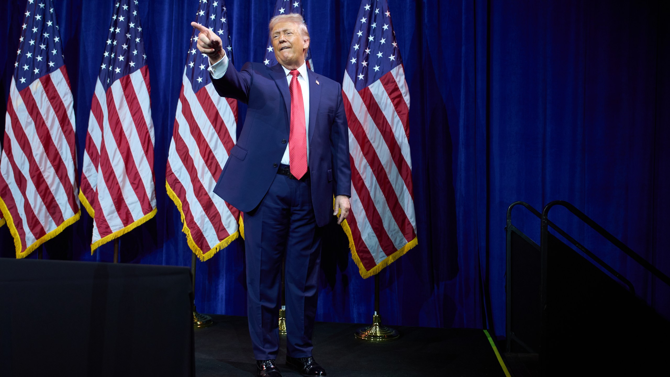 President Donald Trump points to the crowd as he walks off stage after speaking to House Republican lawmakers during their annual policy retreat, Tuesday, Jan. 6, 2026, in Washington. (AP Photo/Evan Vucci)