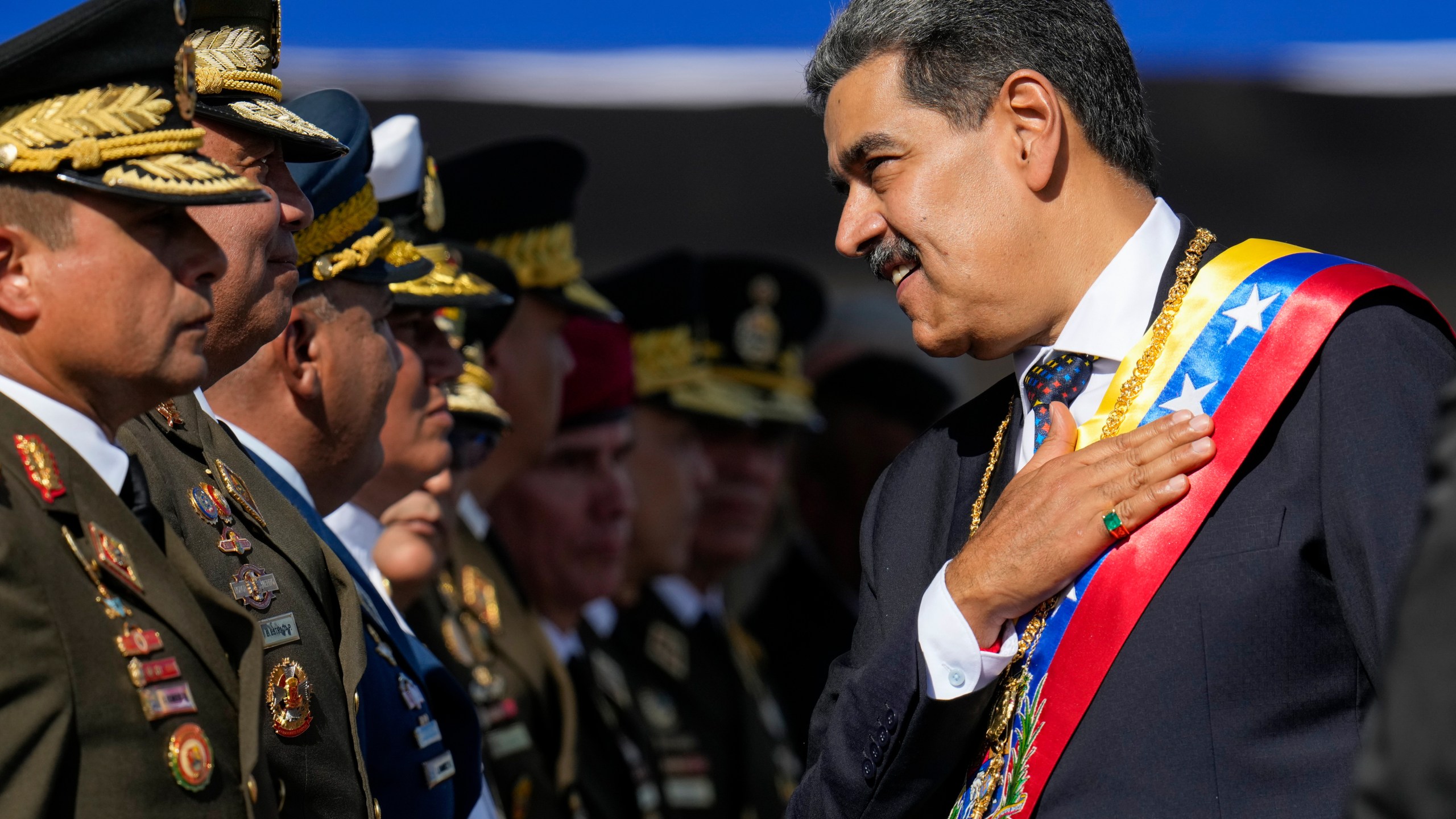 FILE - Venezuela's President Nicolas Maduro places his hand over his heart while talking to high-ranking officers during a military ceremony on his inauguration day for a third term, in Caracas, Venezuela, Jan. 10, 2025. (AP Photo/Ariana Cubillos, File)