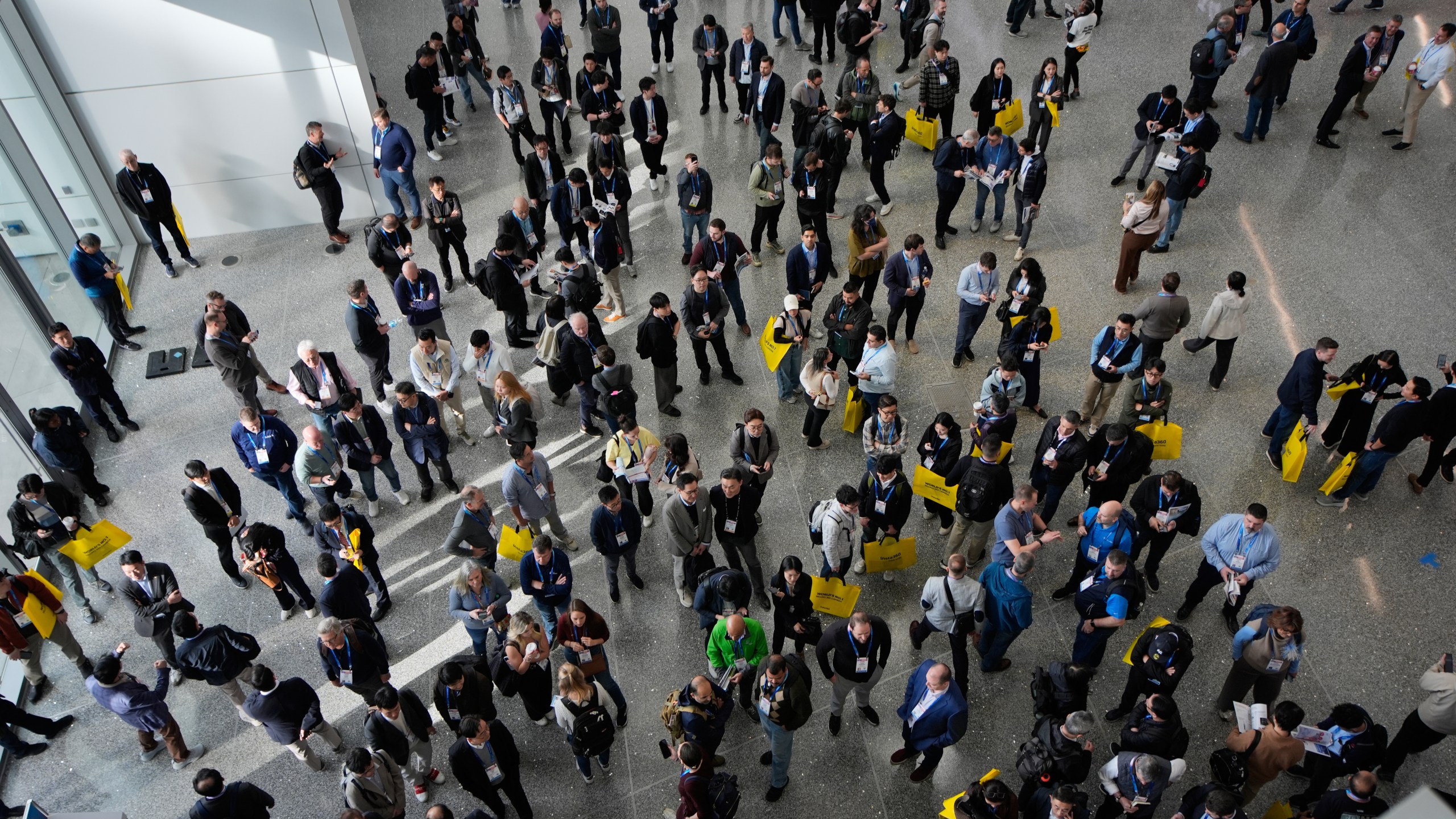 People wait for the opening of the CES tech show Tuesday, Jan. 6, 2026, in Las Vegas. (AP Photo/John Locher)