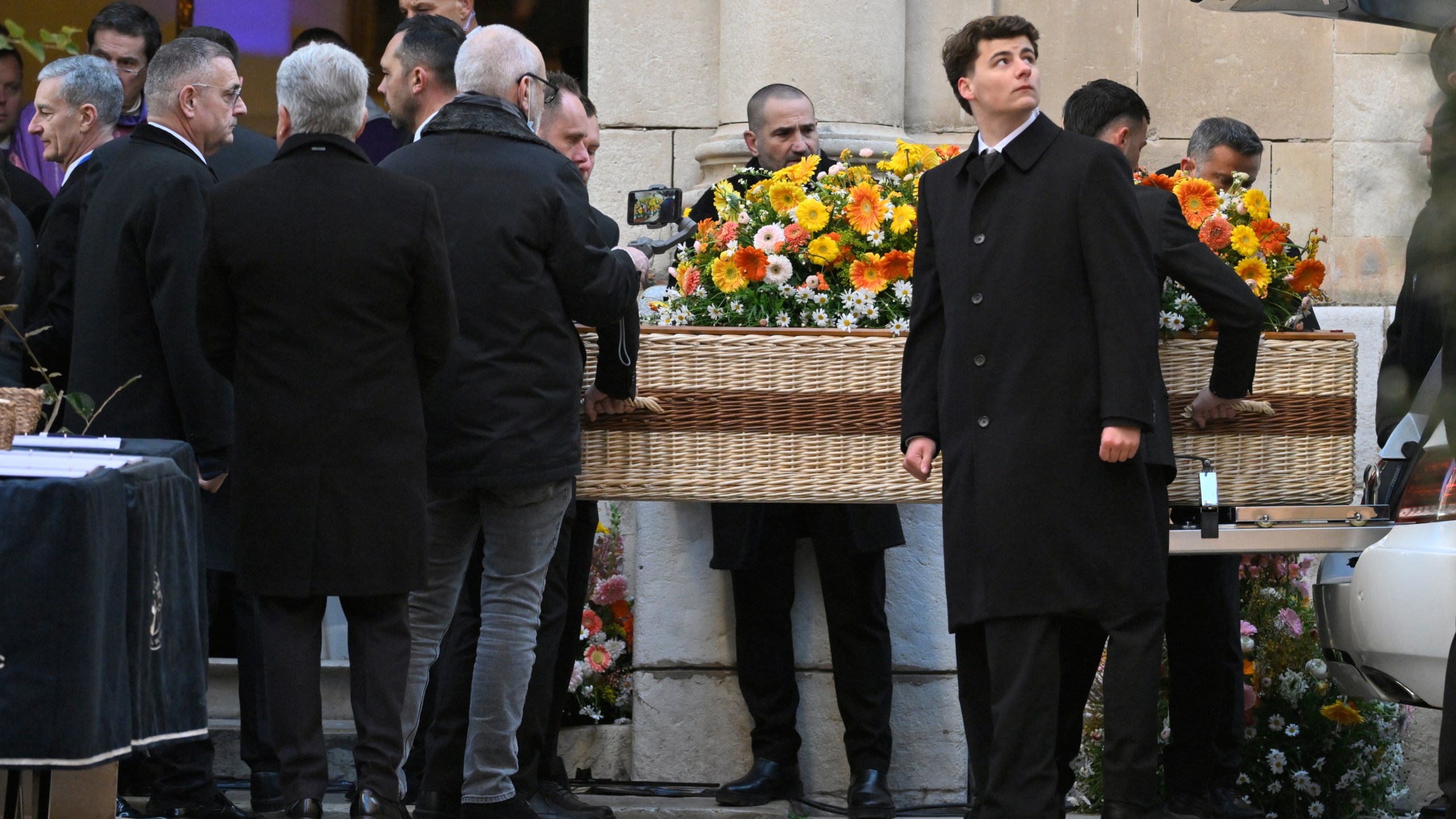 Actor Brigitte Bardot's coffin is carried outside Notre-Dame de l'Assomption church for her funeral ceremony, Wednesday, Jan. 7, 2026 in Saint-Tropez, southern France. (AP Photo/Philippe Magoni)