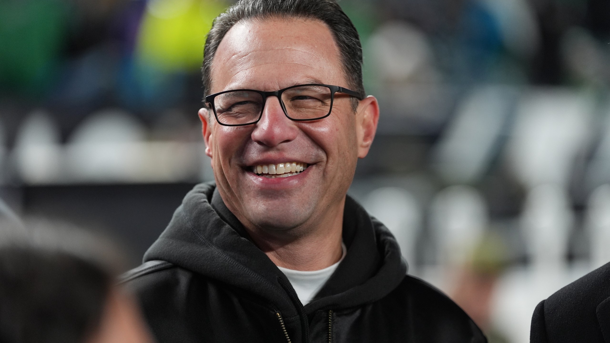FILE - Pennsylvania Gov. Josh Shapiro watches warm ups before an NFL football game between the Philadelphia Eagles and the Detroit Lions on Sunday, Nov. 16, 2025, in Philadelphia. (AP Photo/Matt Slocum, File)