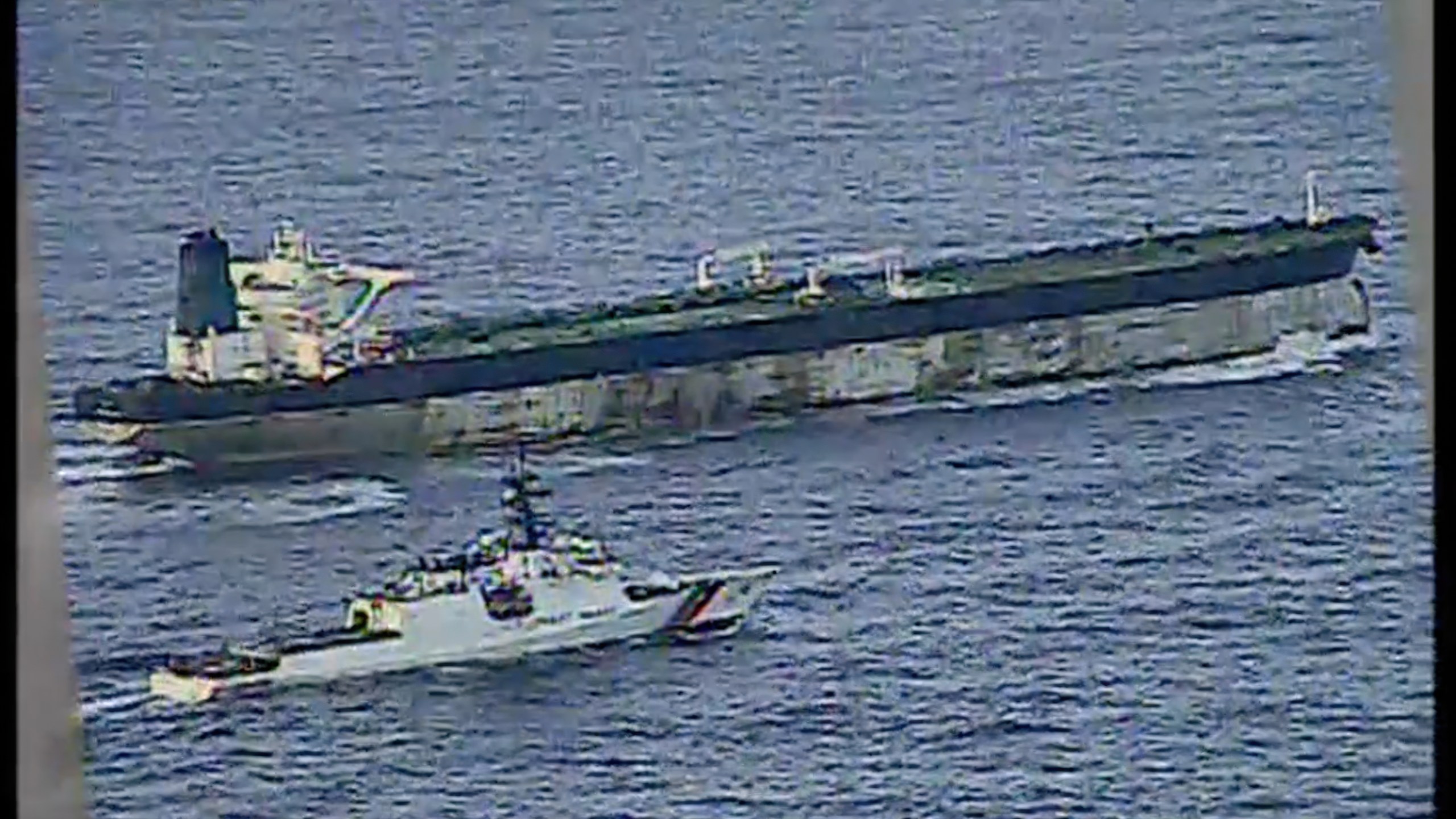 This image from video provided by the U.S. Department of Defense, shows the U.S. Coast Guard cutter Munro shadowing the MV Bella 1 in the North Atlantic Ocean during the maritime interdiction operation Wednesday, Jan. 7, 2026. (Department of Defense via AP)