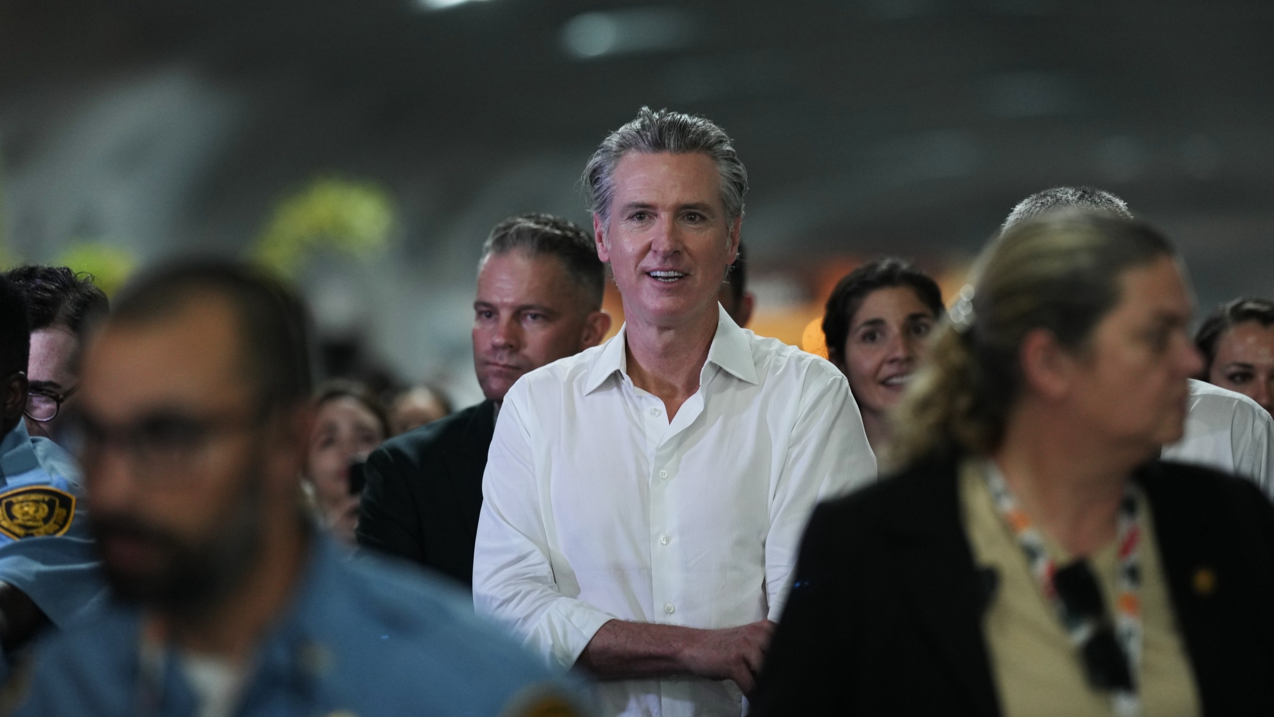 FILE - California Gov. Gavin Newsom walks through the venue for the COP30 U.N. Climate Summit, Tuesday, Nov. 11, 2025, in Belem, Brazil. (AP Photo/Andre Penner, File)