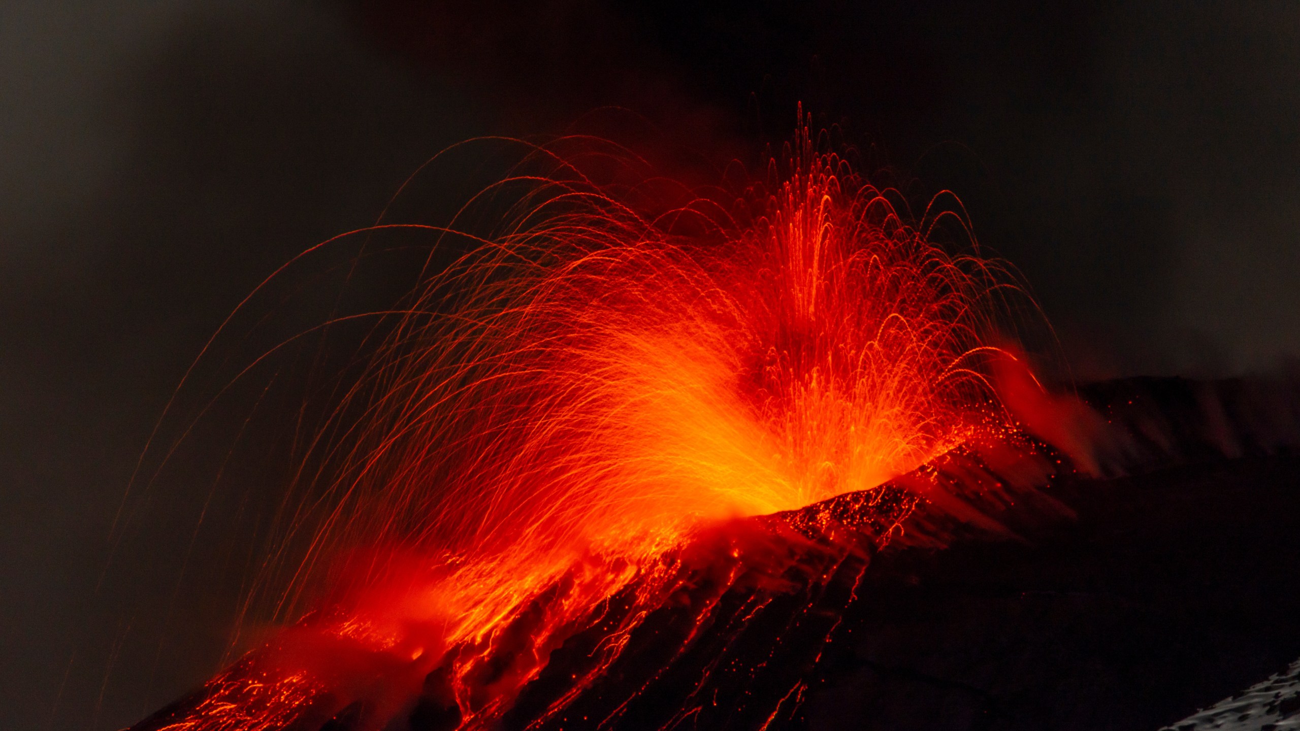 Explosive activity concentrates at the north-east crater of the Mount Etna, as an eruption started on Dec. 24 continues, in Sicily, Italy, Monday Dec. 29, 2025. (AP Photo/Salvatore Allegra)