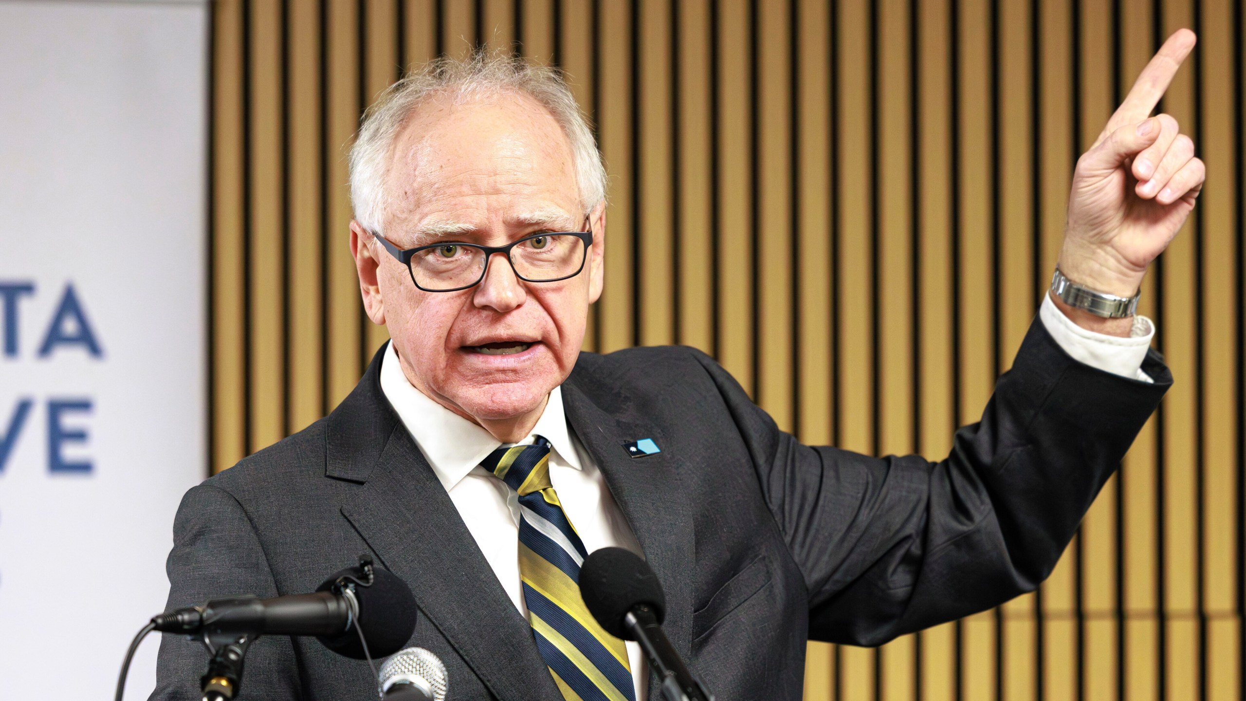 Minnesota Gov. Tim Walz responds to questions from reporters regarding whether he will seek a third term during a press conference following an event on the state's new Paid Family and Medical Leave program, Tuesday, Jan. 6, 2026, in Minneapolis. (Kerem Yücel/Minnesota Public Radio via AP)