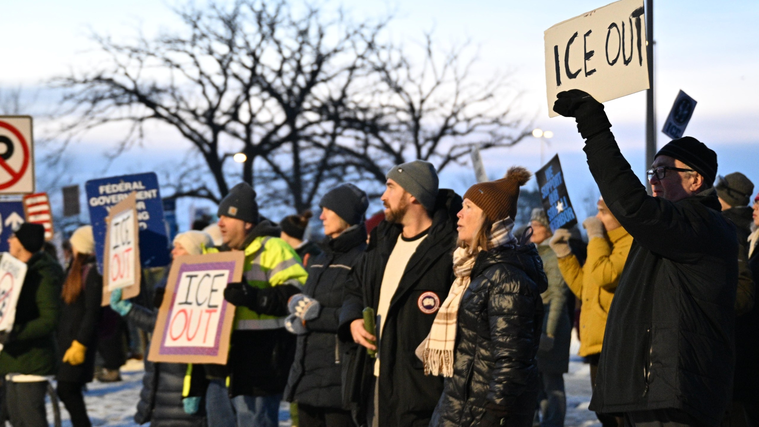 Protesters gather outside the Bishop Henry Whipple Federal Building, Thursday, Jan. 8, 2026, in Minneapolis, Minn. (AP Photo/Tom Baker)