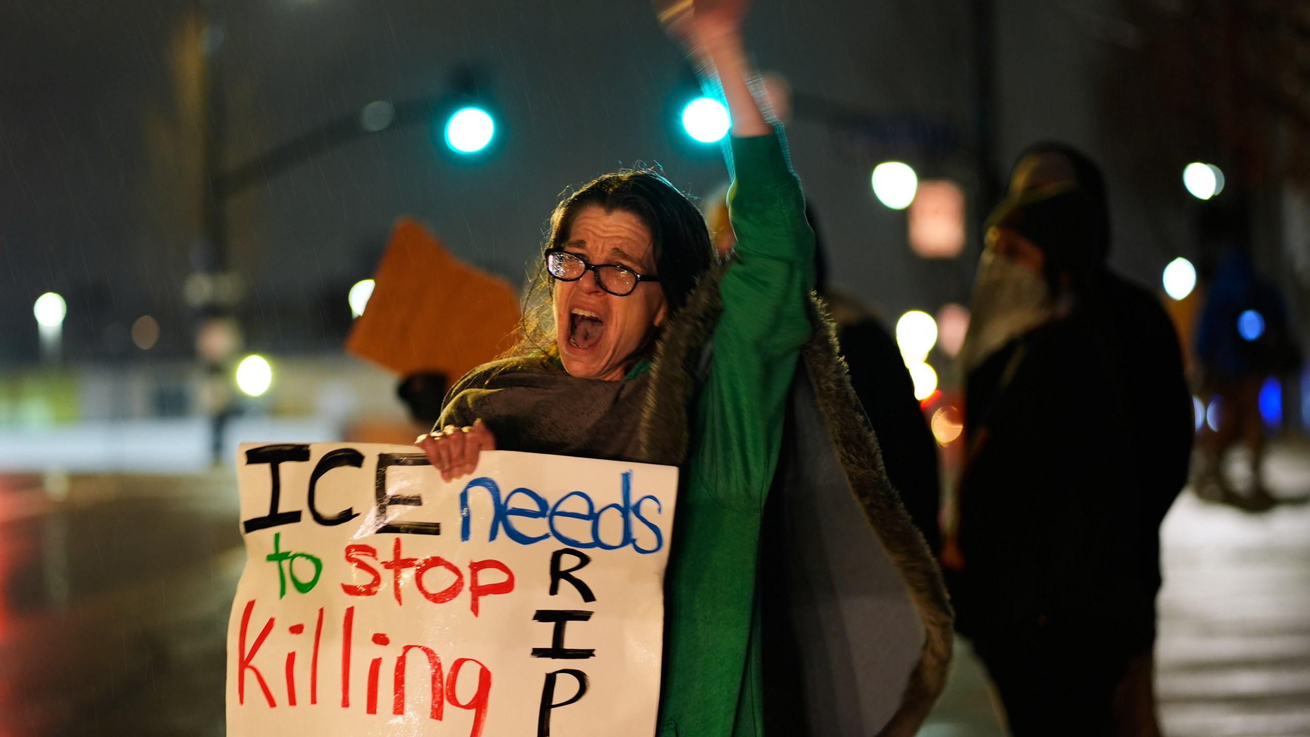 Shellie Rodgers protests during a rally for Renee Good, who was fatally shot by an ICE officer in Minneapolis the day before, Thursday, Jan. 8, 2026, in Kansas City, Mo. (AP Photo/Charlie Riedel)