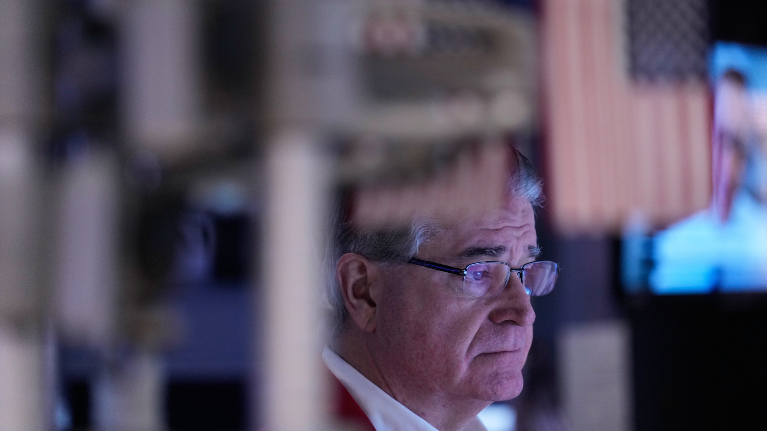 Daniel Kryger works on the floor at the New York Stock Exchange in New York, Friday, Jan. 9, 2026. (AP Photo/Seth Wenig)