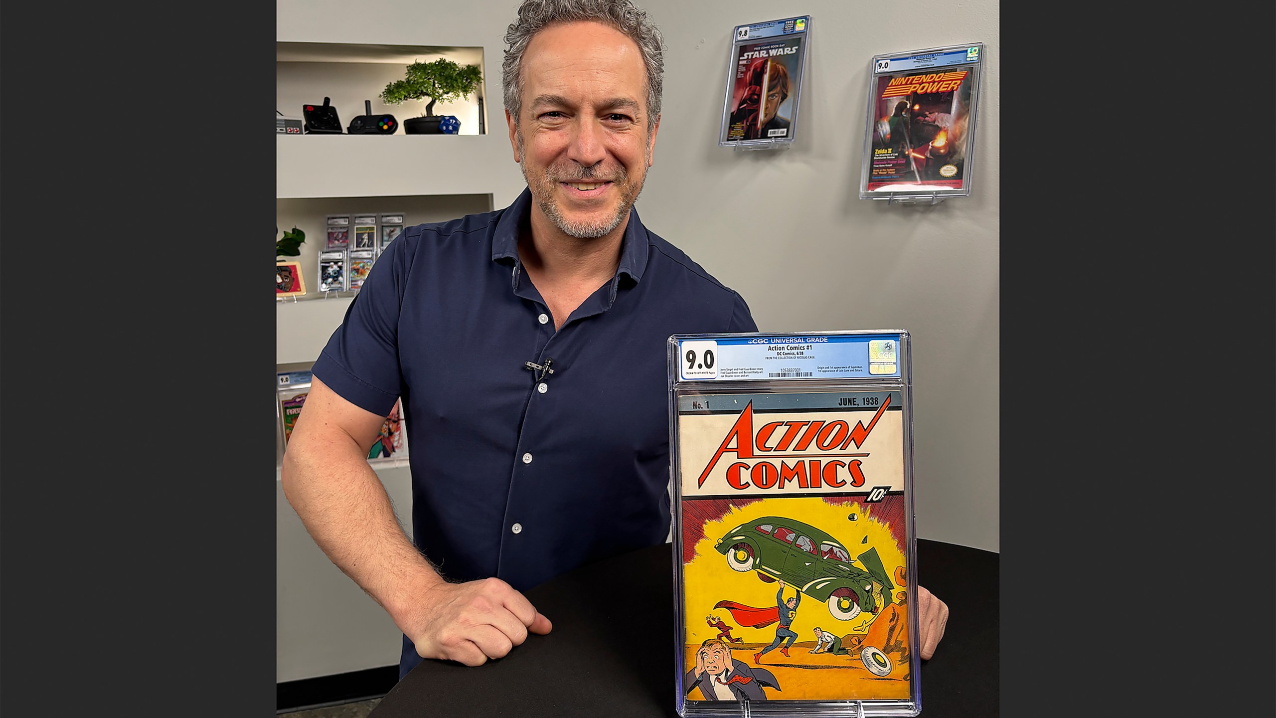 Vincent Zurzolo, president of Metropolis Collectibles/Comic Connect poses for a photo, Monday, Jan. 5, 2026, in New York, with Action Comics #1, a copy of a rare comic book that introduced the world to Superman and was sold for a record $15 million. (Andrew Wilson/Metropolis Collectibles Inc. via AP)
