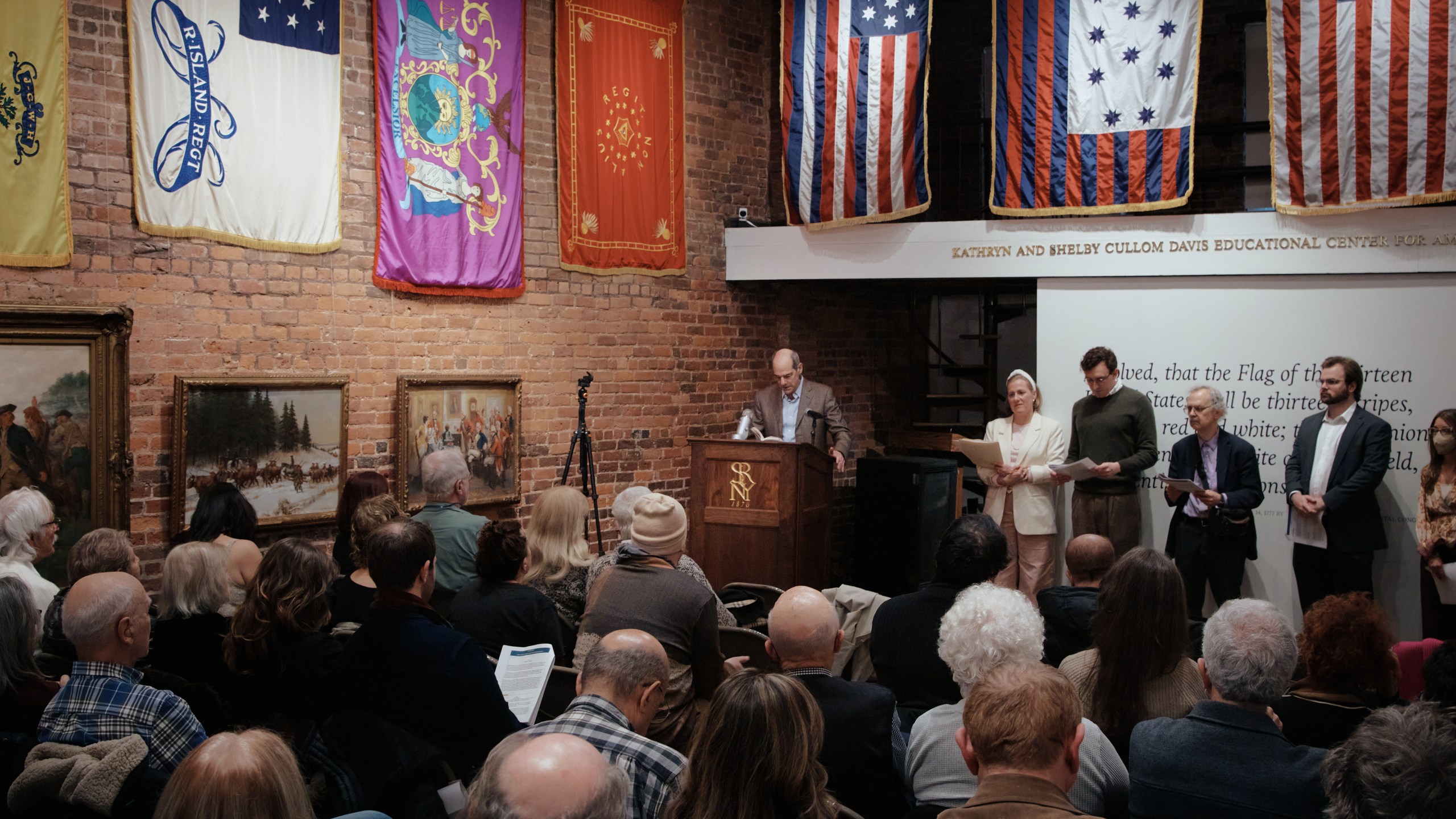 A man orates selected readings from Thomas Paine's Common Sense during an event commemorating the 250th anniversary of the pamphlet's publication at the Fraunces Tavern Museum on Saturday, Jan. 10, 2026, in New York. (AP Photo/Andres Kudacki)