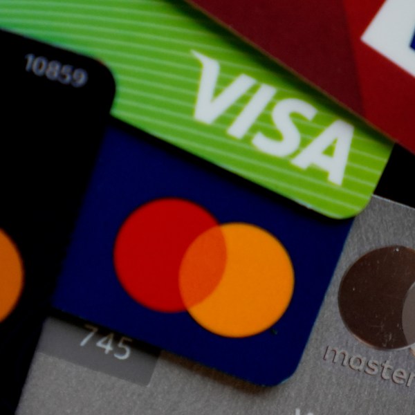 Visa and Mastercard credit cards are shown.