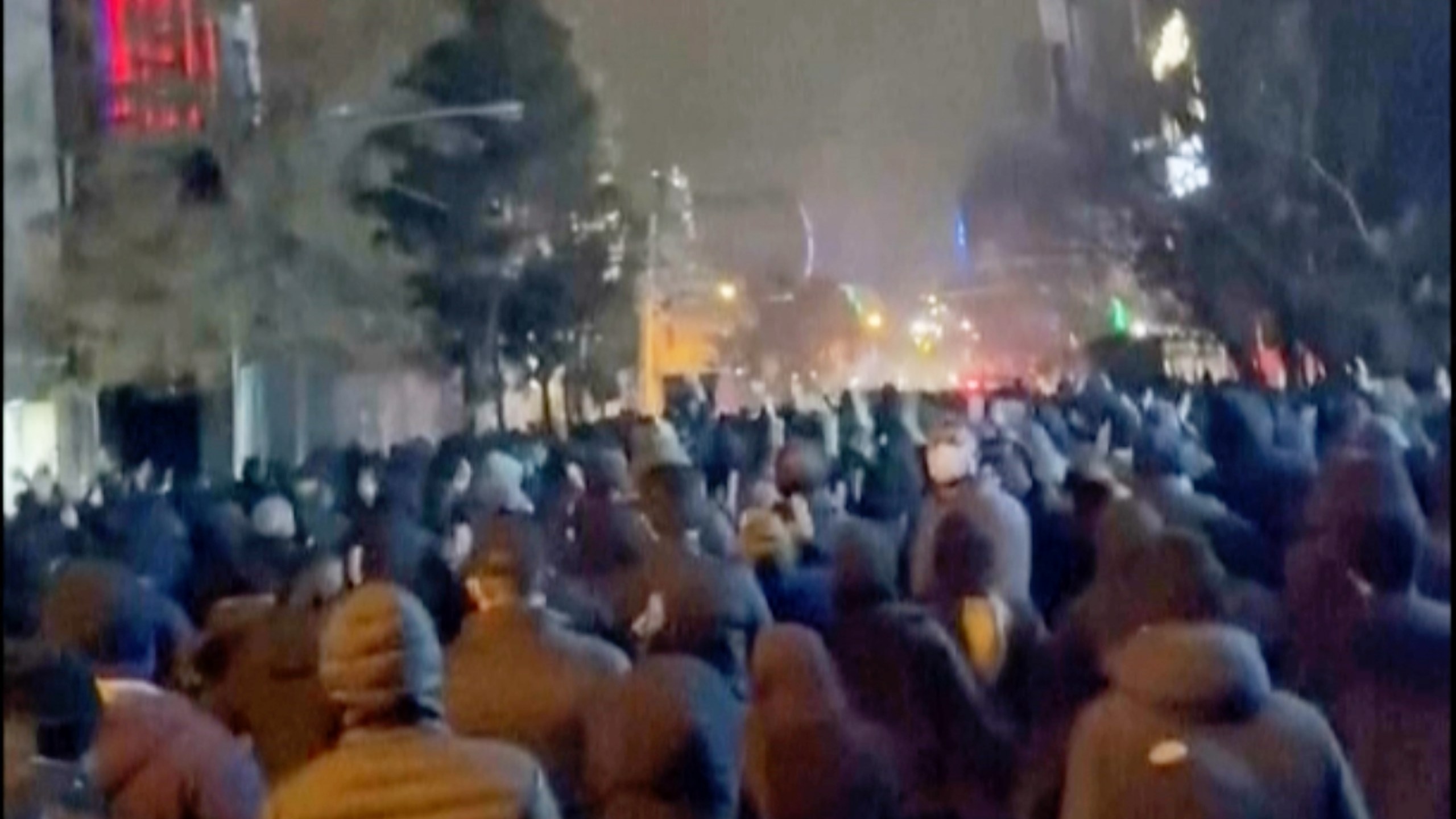 In this frame grab from footage circulating on social media from Iran showed protesters once again taking to the streets of Tehran despite an intensifying crackdown as the Islamic Republic remains cut off from the rest of the world in Tehran, Iran, Saturday Jan. 10, 2026. (UGC via AP)