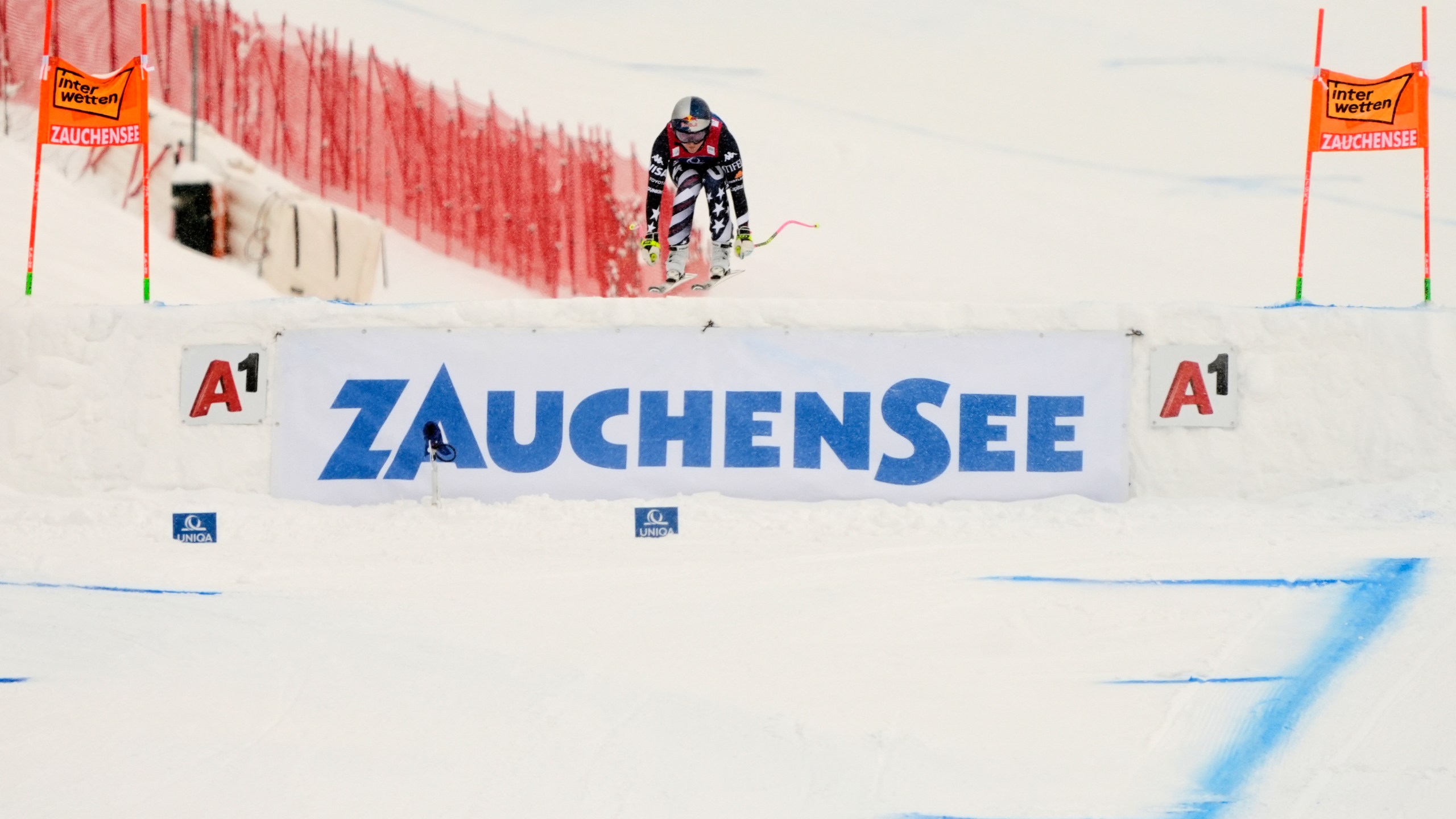 United States' Lindsey Vonn is airborne as she speeds down the course to win an alpine ski, women's World Cup downhill, in Zauchensee, Austria, Saturday, Jan. 10, 2026. (AP Photo/Giovanni Auletta)