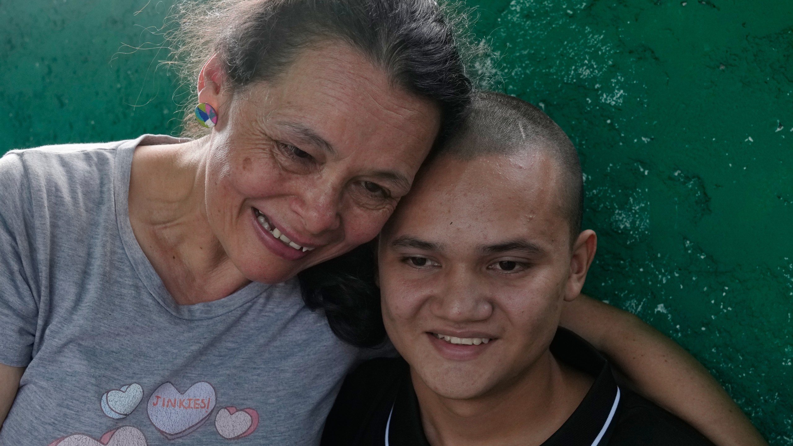 A relative embraces Diogenes Angulo after his release from prison in San Francisco de Yare, Venezuela, Saturday, Jan. 10, 2026. Angulo had been detained two days before the 2024 presidential election. (AP Photo/Ariana Cubillos)