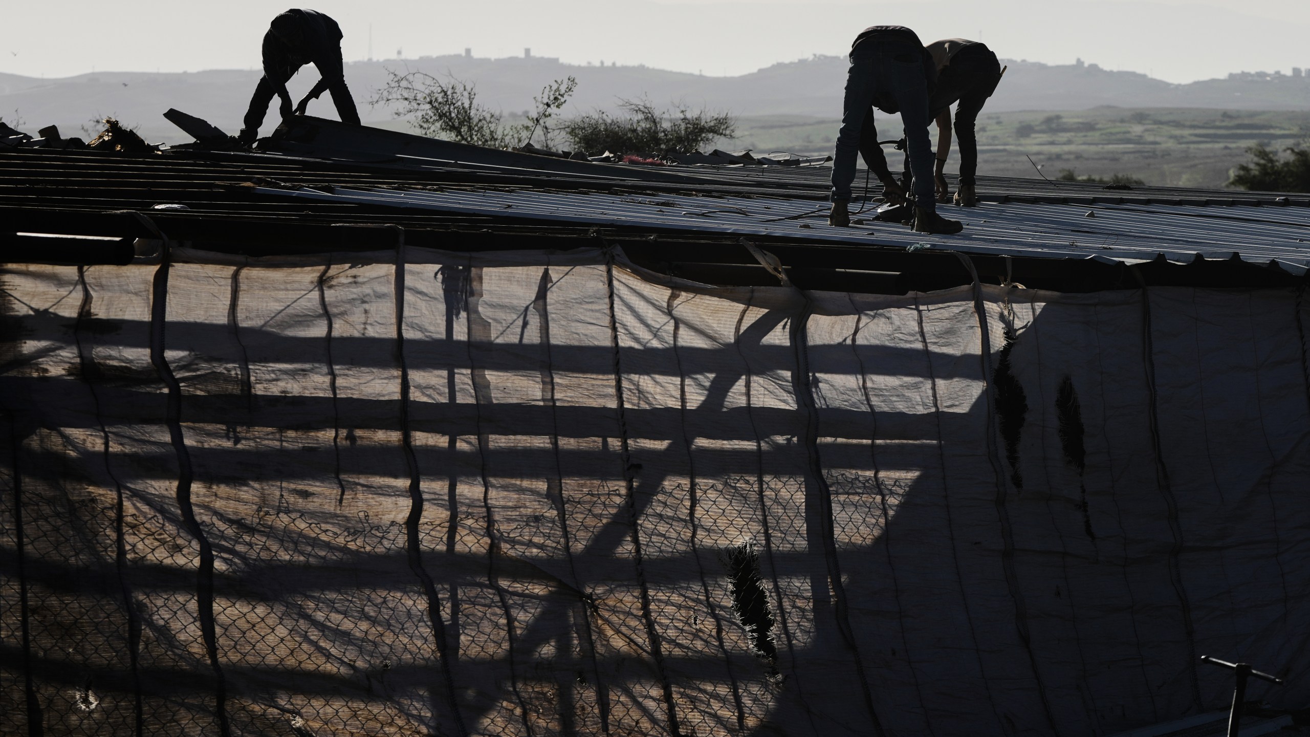 Palestinian residents of Ras Ein al-Auja village, West Bank pack up their belongings and prepare to leave their homes after deciding to flee mounting settler violence, Sunday, Jan. 11, 2026. (AP Photo/Mahmoud Illean)