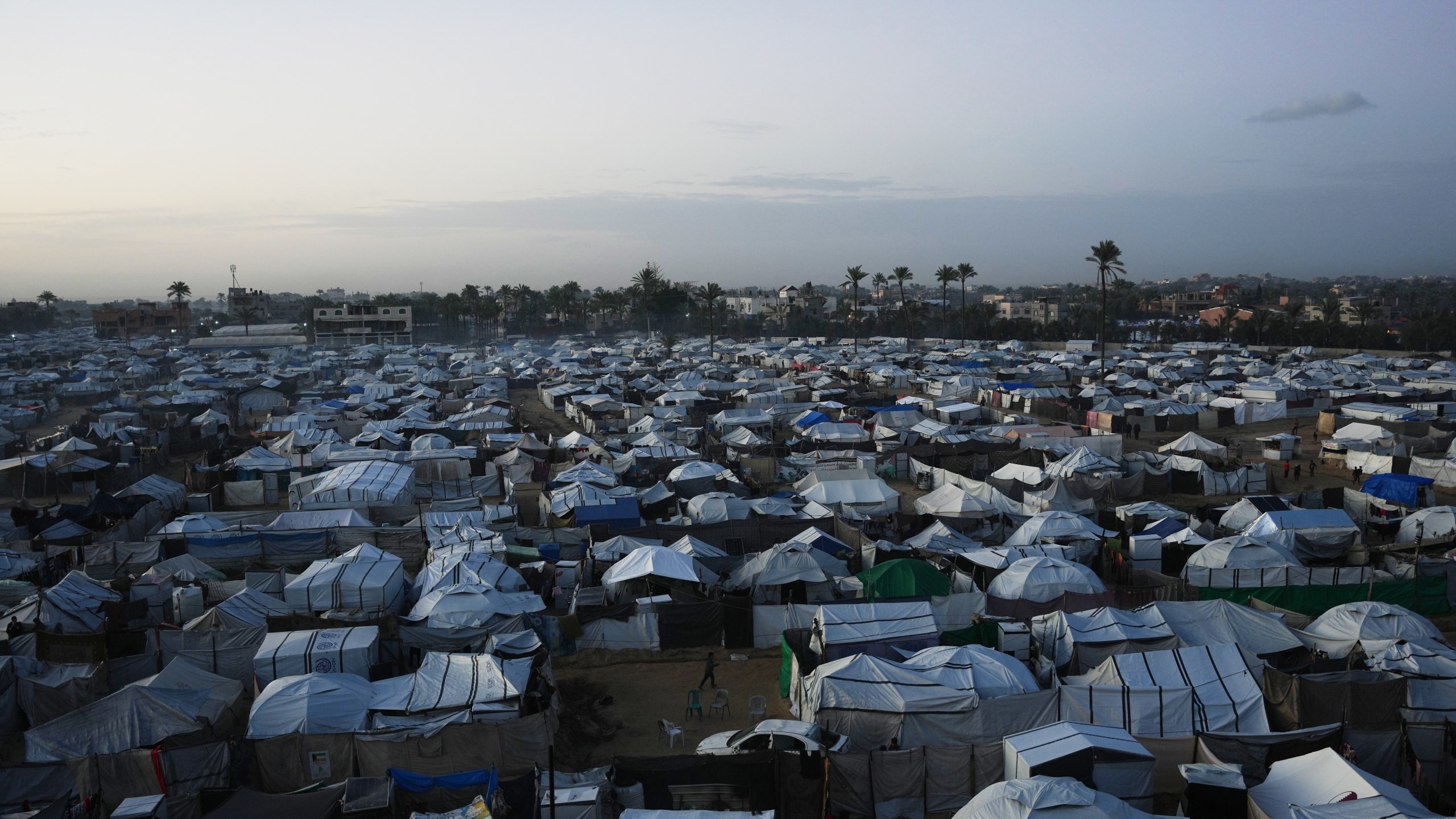 A tent camp for displaced Palestinians stretches across an area in Deir al-Balah, in the central Gaza Strip, Saturday, Jan. 10, 2026. (AP Photo/Abdel Kareem Hana)
