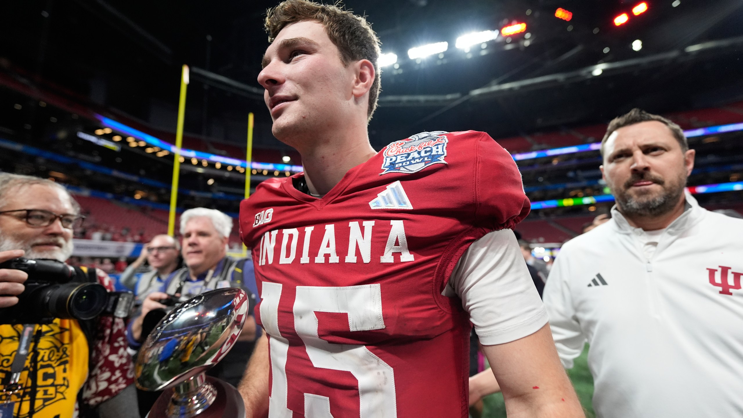 Indiana quarterback Fernando Mendoza (15) celebrates after the Peach Bowl NCAA college football playoff semifinal against Oregon, Friday, Jan. 9, 2026, in Atlanta. (AP Photo/Brynn Anderson)