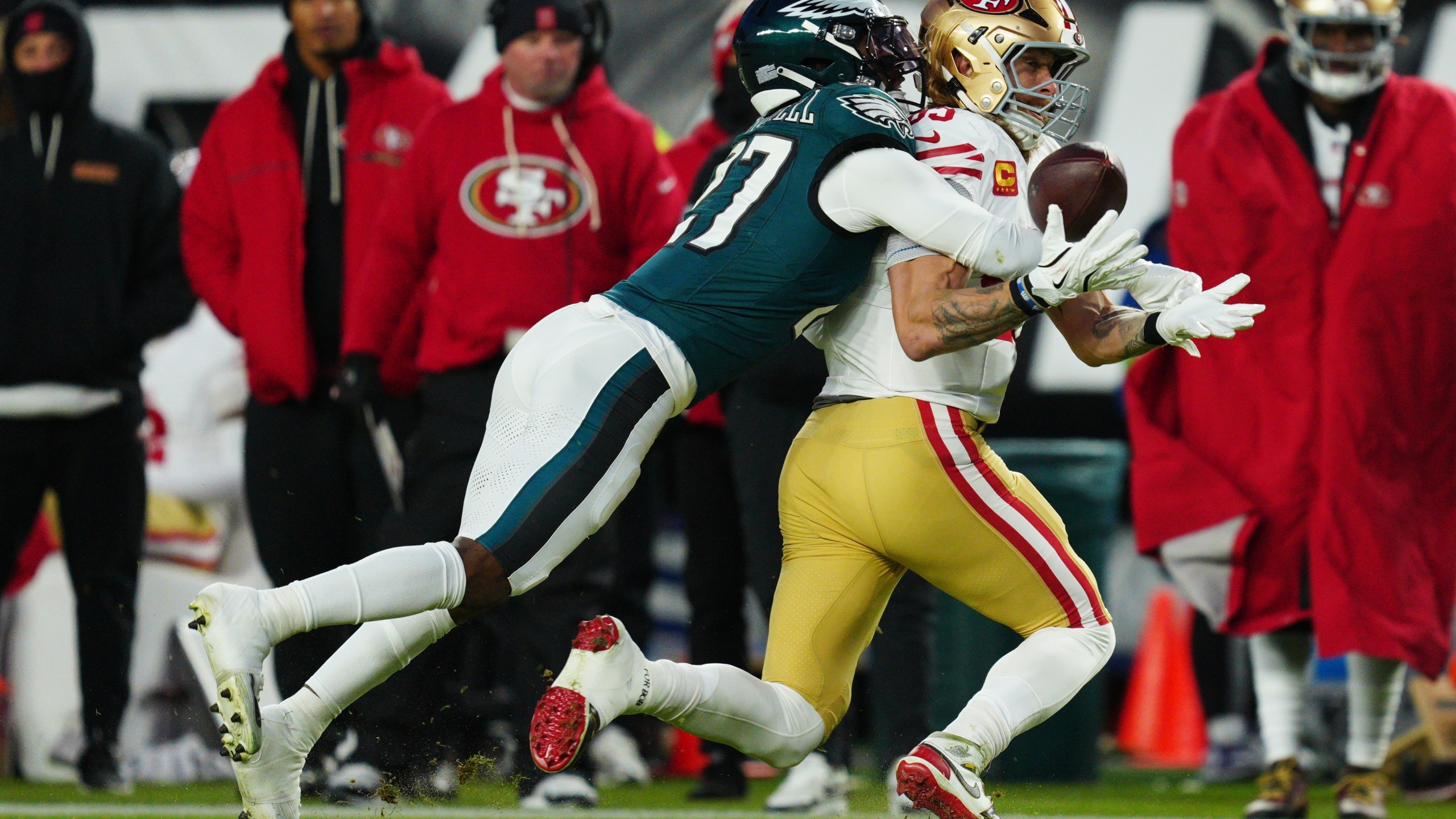 Philadelphia Eagles cornerback Quinyon Mitchell (27) breaks up a pass intended for San Francisco 49ers tight end George Kittle (85) during the first half of an NFL wild-card playoff football game Sunday, Jan. 11, 2026, in Philadelphia. (AP Photo/Derik Hamilton)